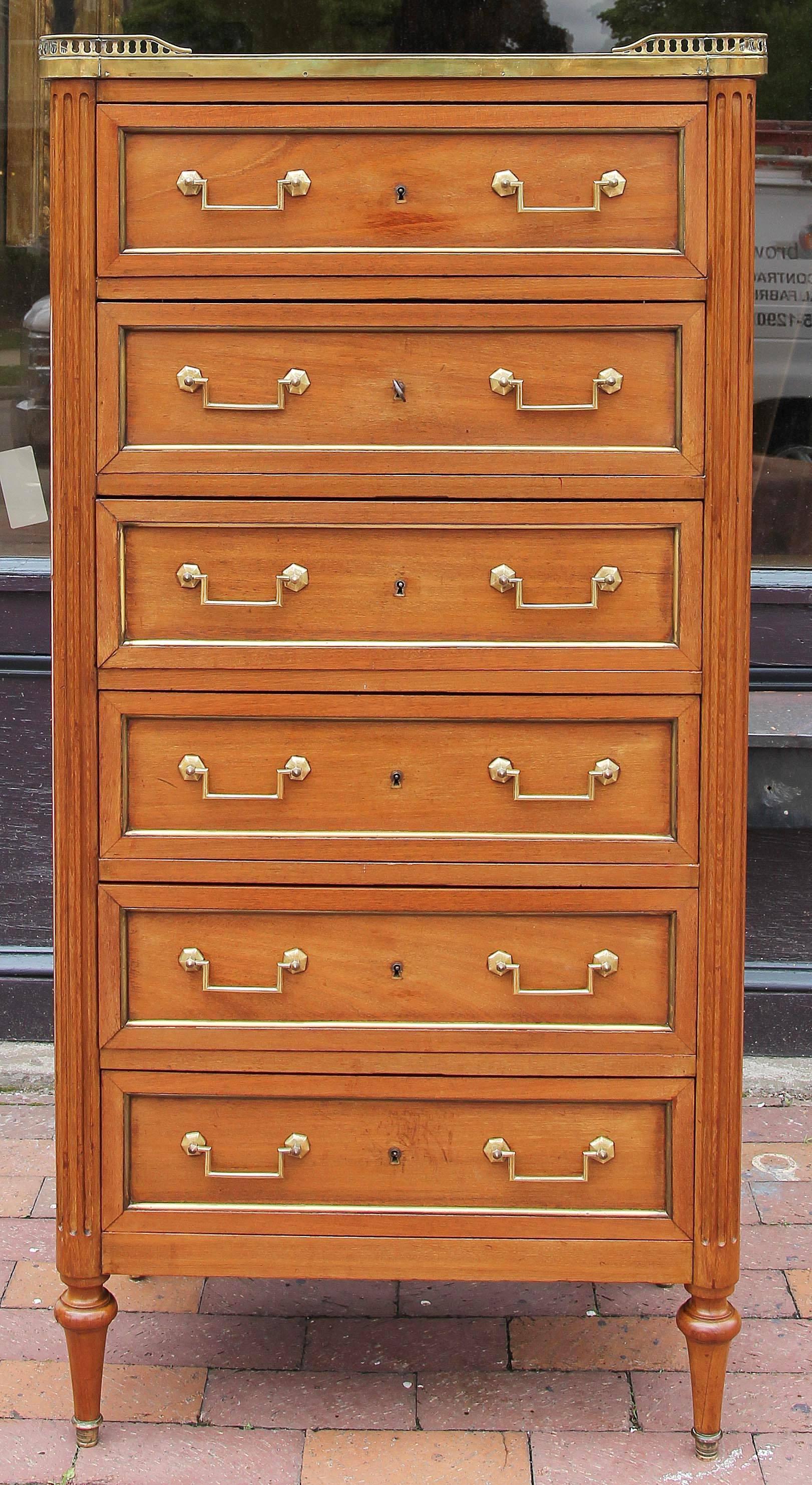 Antique Louis XVI style tall chest. Six drawers. Marble top with bass gallery. Brass hardware and brass molding through out, French, circa 1920.