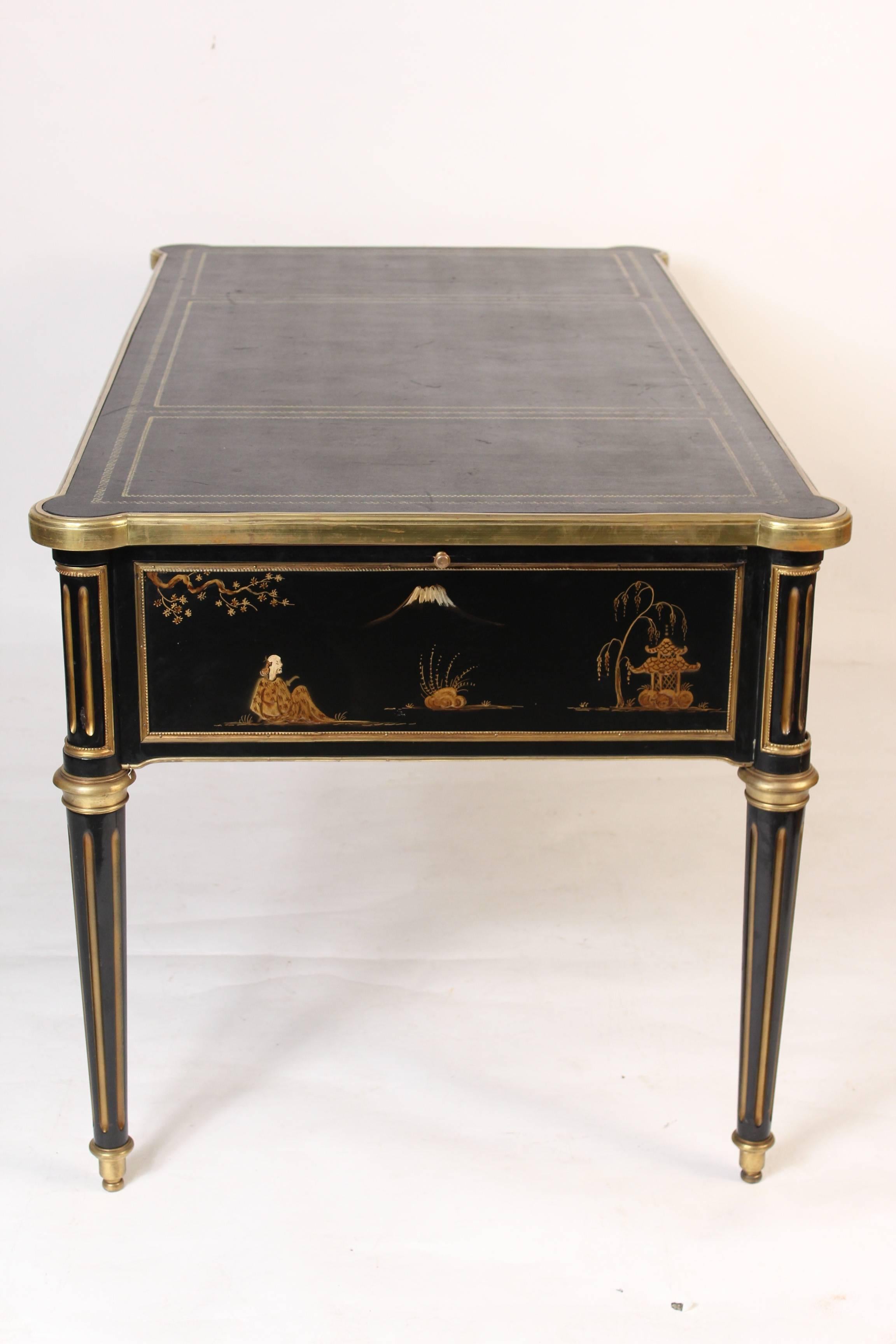 Louis XVI style chinoiserie decorated desk with gilt bronze mounts and a leather top, late 20th century.