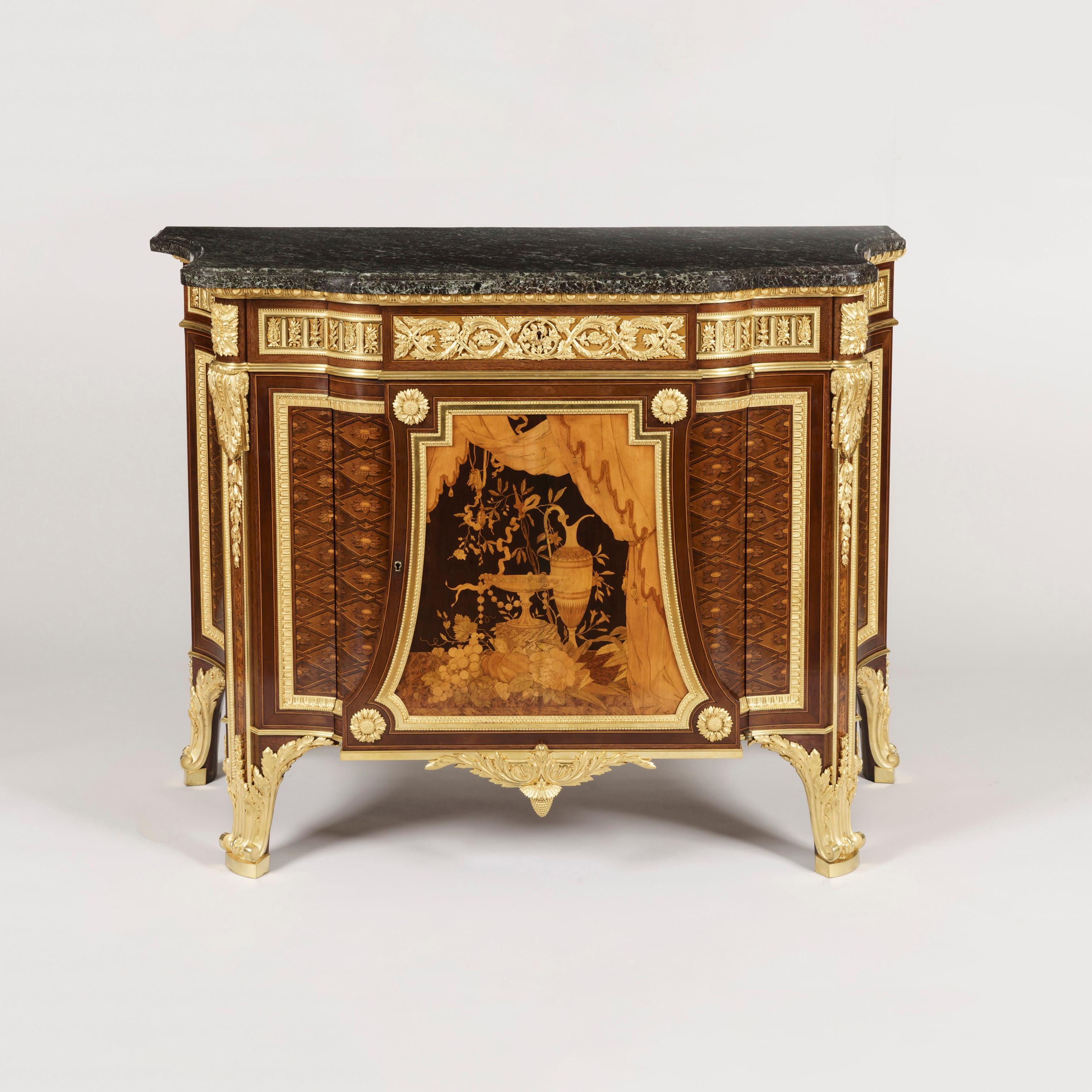 A very fine Louis XVI style gilt bronze-mounted marquetry commode
By Charles Guillaume Winckelsen 

After a model by Jean-Henri Riesener, supplied to Marie-Antoinette for Versailles. Constructed in a finely patinated harewood, with a saint-Anne