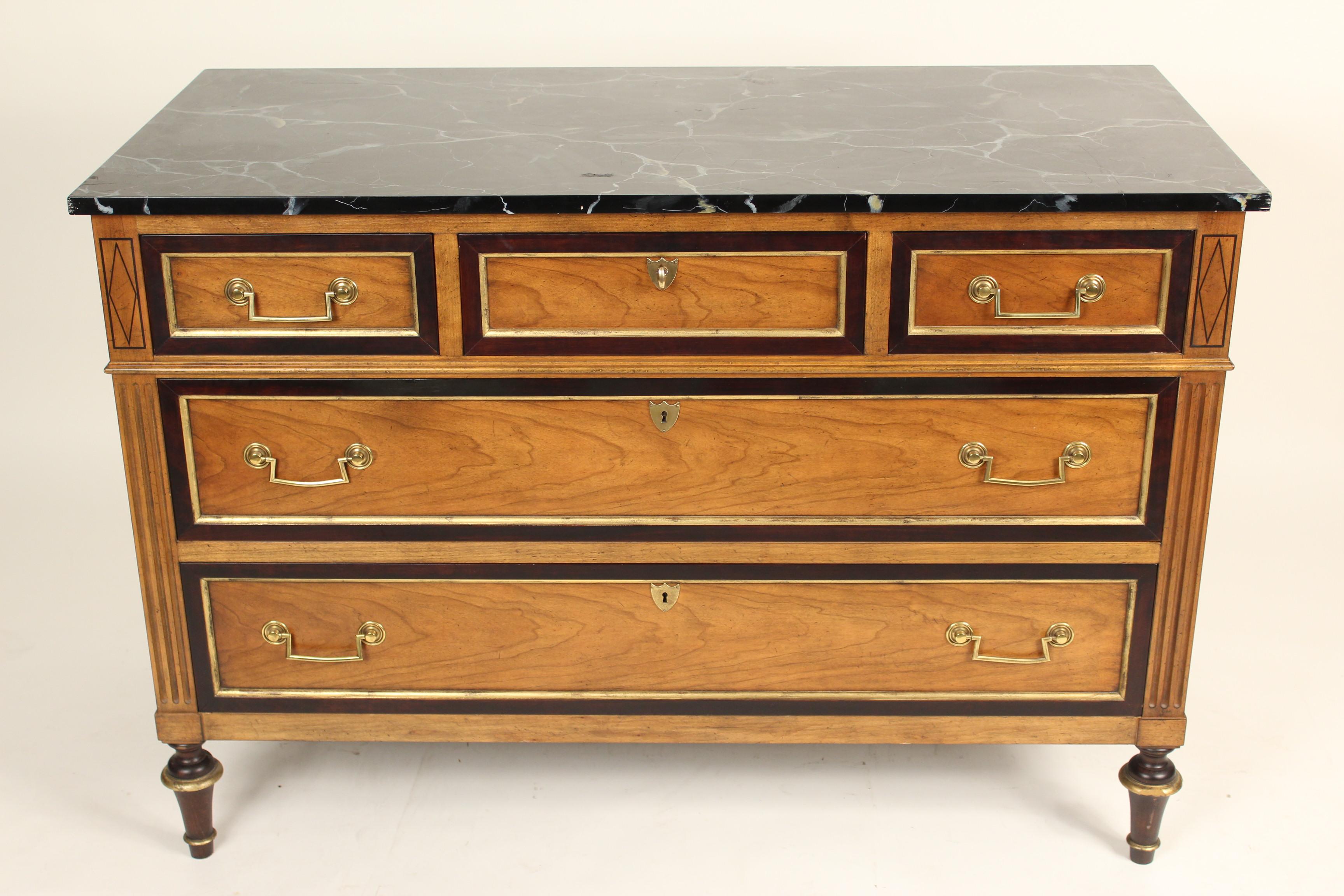 Louis XVI style fruitwood chest of drawers with a faux marble top (wood painted to look like marble) top and brass pulls, made by Baker, late 20th century.