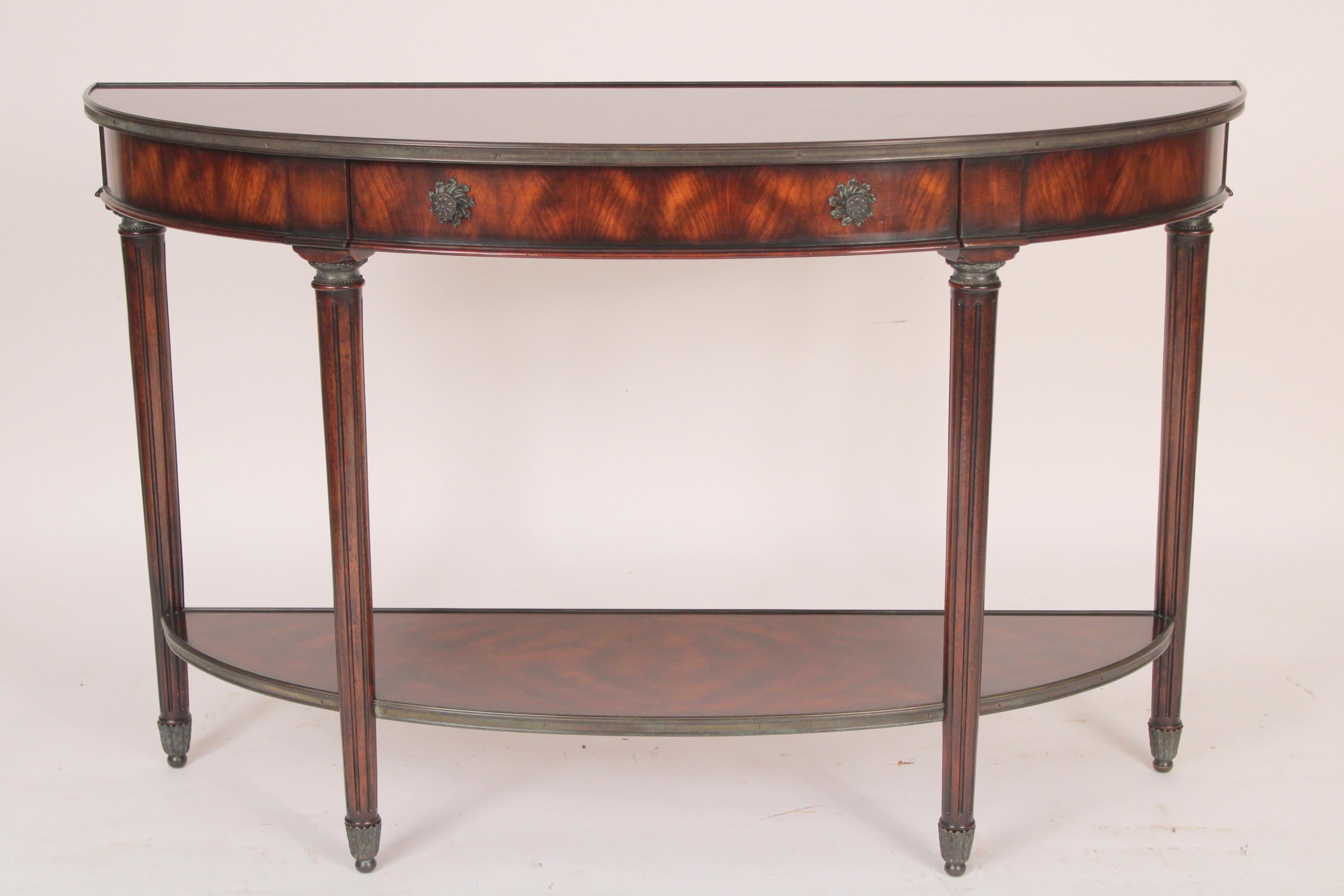 Louis XVI style mahogany demi lune console table with brass mounts, made by Theodore Alexander, late 20th century. With exquisite quality mahogany used throughout.