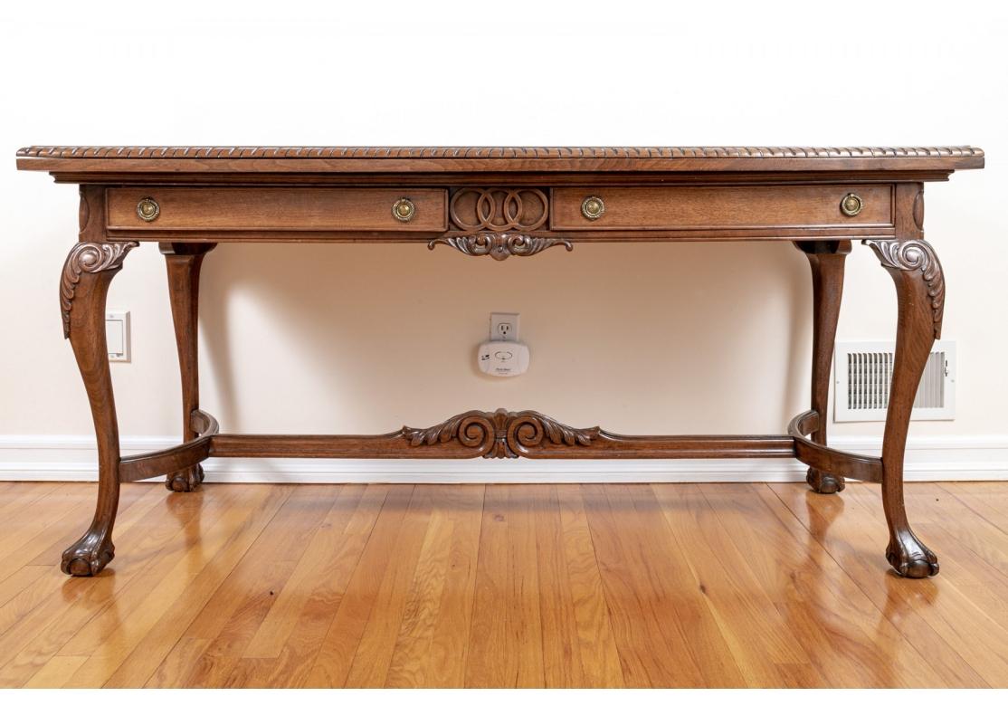 A very well made, solid feeling Console Table with the ability to double its size with a flip top feature. This table has large rectangular top over beautifully carved  apron and two drawers, one lined with felt and divided for organized flatware
