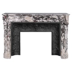 Louis XVI style curved mantel in Breche violette decorated with a Greek frieze