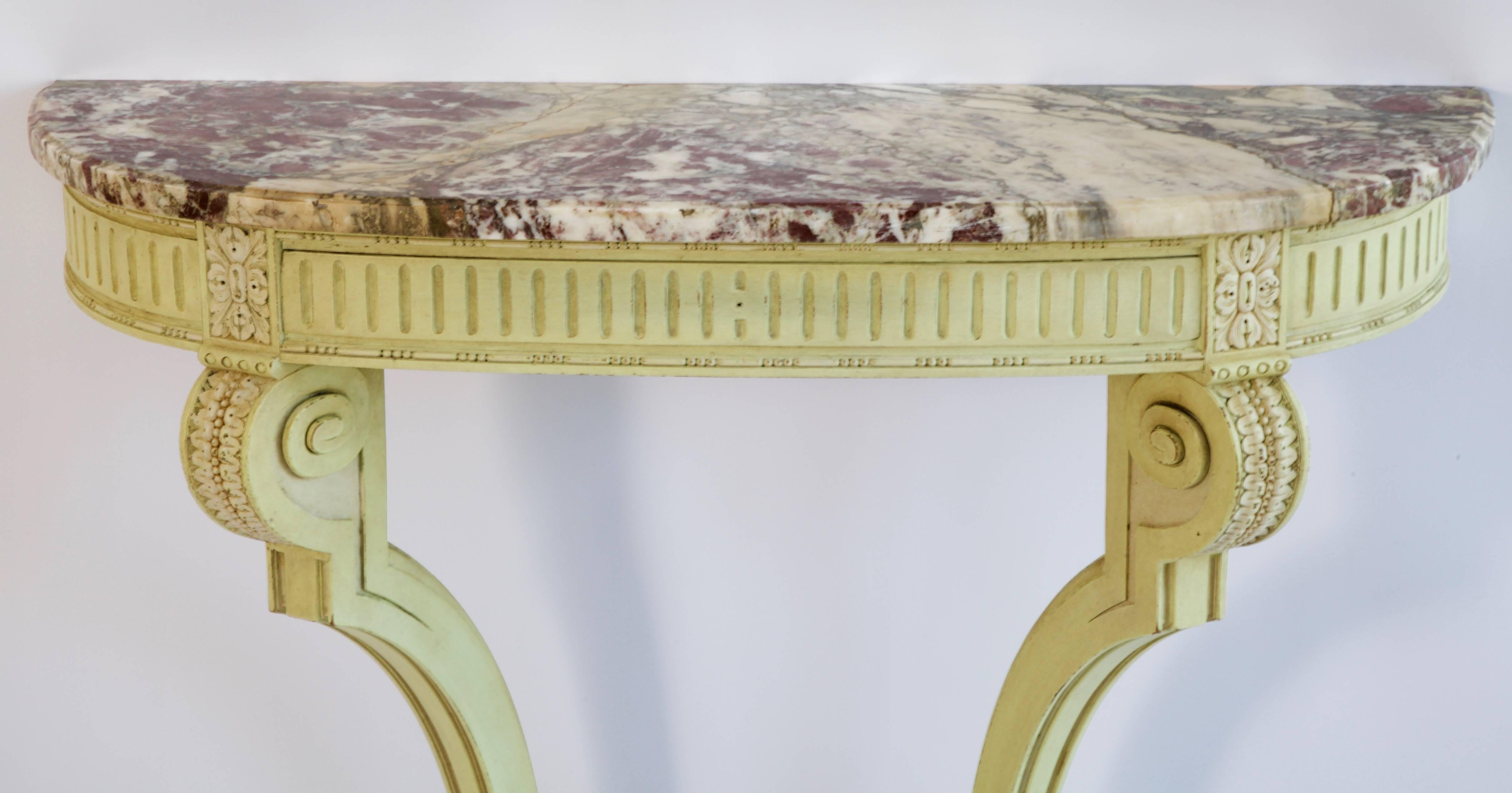 Louis XVI style demilune console, painted in a Georgian green with white highlights.
Fitted with one drawer and an elegant breche marble.
Originally in an entrance hall.