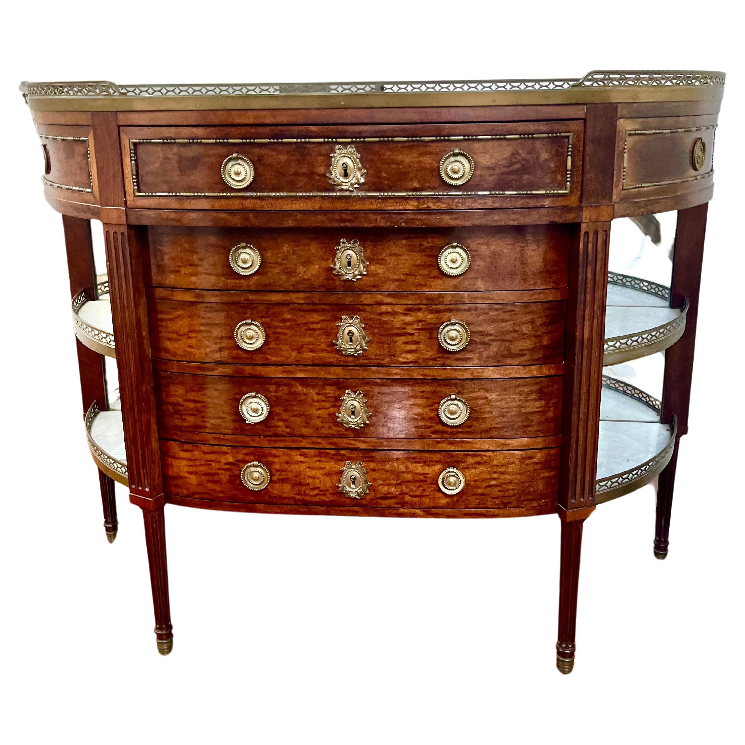 An unusual Desserte console  in what may be the fabled plum pudding mahogany. Locks stamped ‘Paris’ ( see photo ) . The galleried top encasing a grey veined white marble top ( no cracks ) over a projected top drawer over  four recessed doors flanked