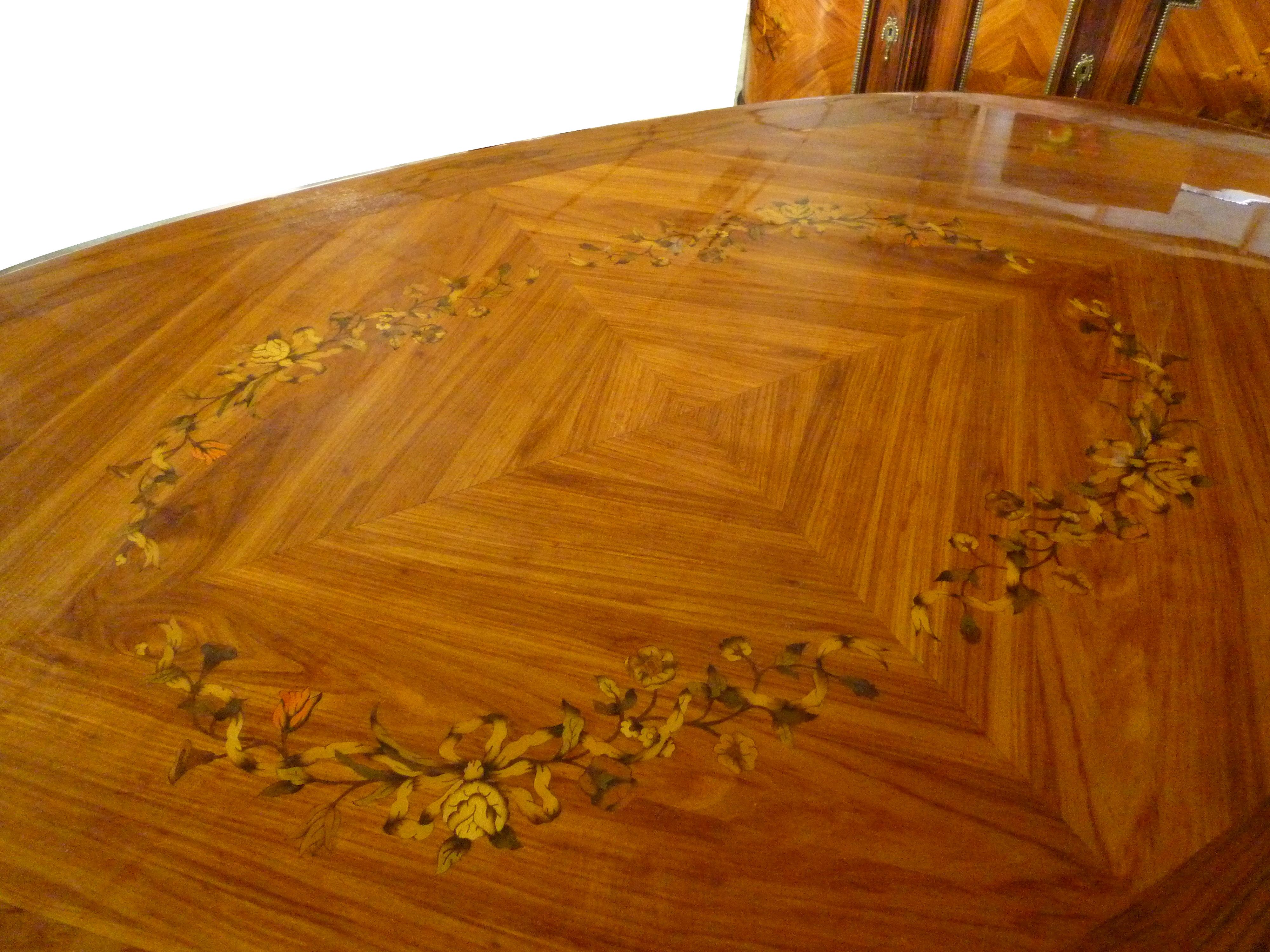 Oval dining table rosewood inlaid with flowers and gilt bronze decoration
By JP Ehalt French Marquetry dining table
JP Ehalt is a well renowned and reputable manufacturer in France.
The Ehalt Fine furniture company was founded in 1924 in