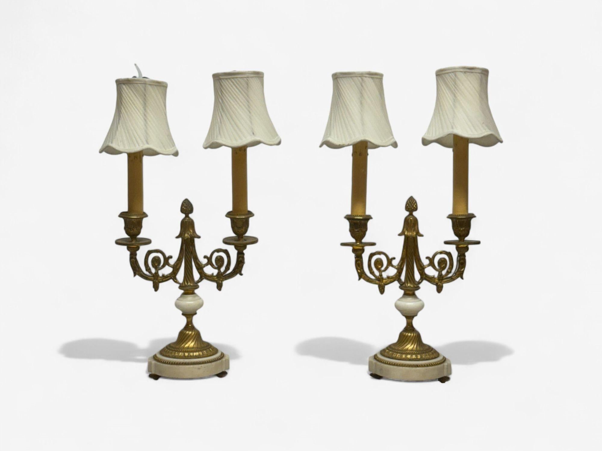 Louis XVI Style, Dore Bronze, Marble, Candelabras, France, 19th c.

Elegant 19th to early 20th century doré bronze and marble candelabra converted to table lamps. Featuring finely cast bronze, marble bases and central columns, each with two