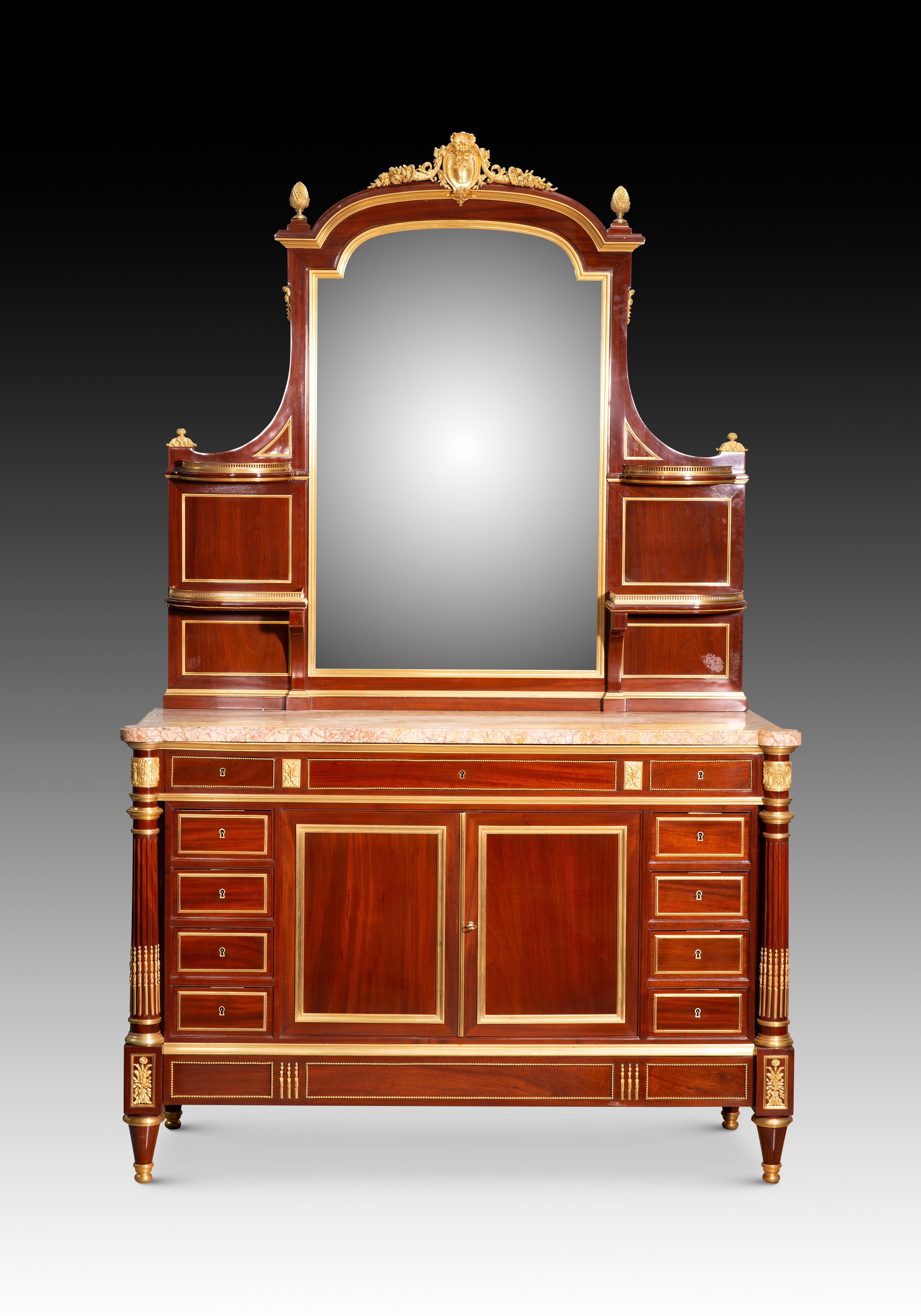 Louis XVI style dressing table. Woods, etc. Guéret Frères, Paris, France, 19th century.

Marks on the back (stamping).

Dressing table with a mirror topped with a crest and two gilt-bronze pine cones, flanked by two shelves on each side with