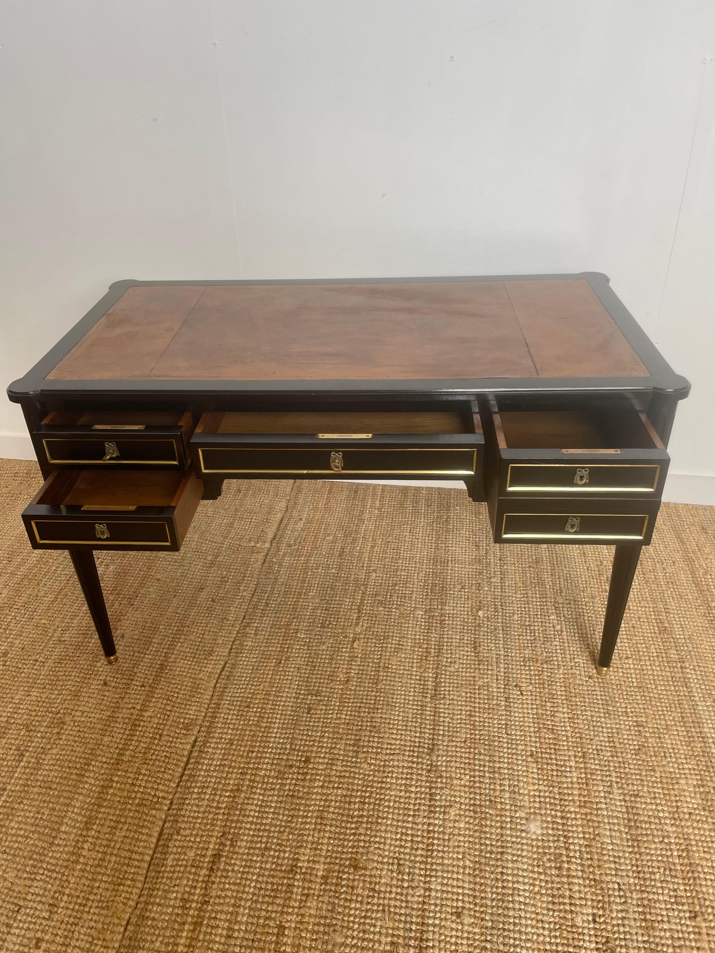 Quality early 20th Century French Louis XVI style writing desk.
Dating to around the 1930’s with original brass mounts and leather inserts and two pull out slides with original leathers. With two keys and working locks.
This piece can free stand in