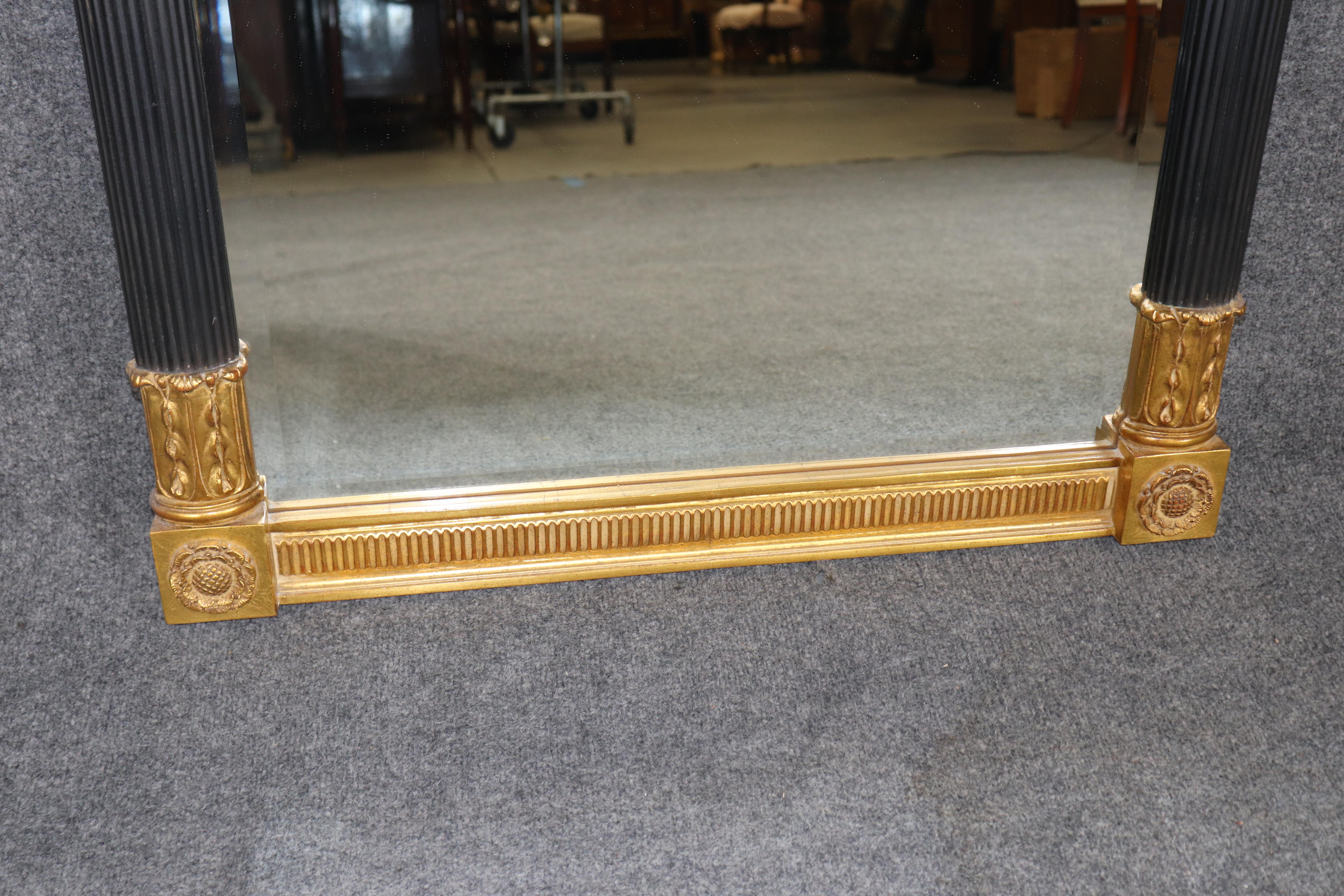 20ième siècle Miroir biseauté sculpté, ébonisé et doré de style Louis XVI par Carver's Guild en vente