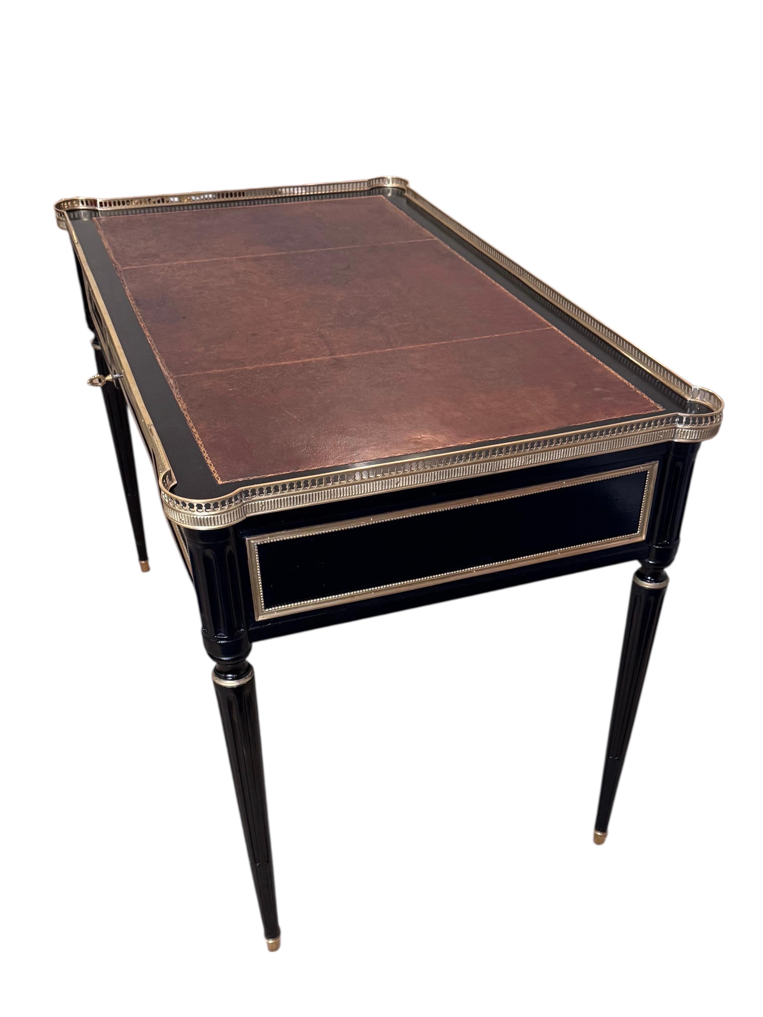 Louis XVI Style Ebonized Bureau Plat 
  Finely crafter late 19th century Mahogany, oak 
& Gilt bronze mounted desk. Has 3 drawers on one side & false drawers on the back side 
  Desk has its original leather top it  has been 
Professionally French