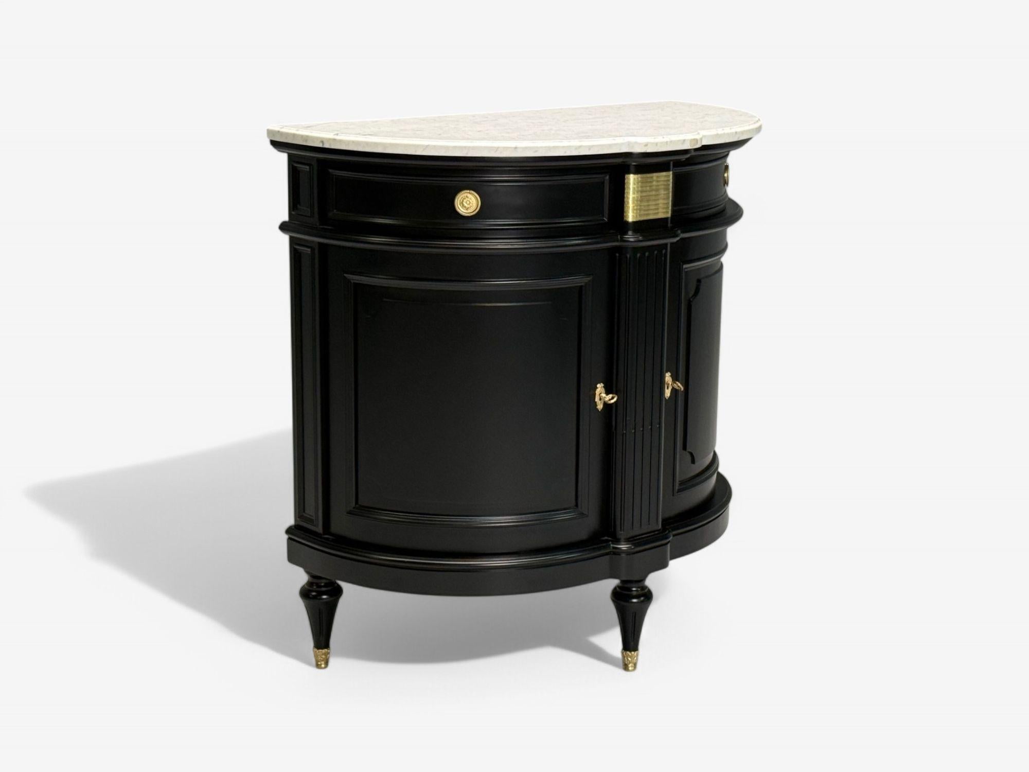Hollywood Regency, Louis XVI Style, Ebony, Bronze, White Marble, Demi Lune Server, Console Table, France, 1930s

A stunning Maison Jansen-inspired console or serving table in the Louis XVI style. This elegant deep demi-lune mahogany case has been