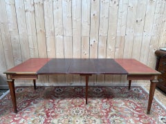Louis XVI style extendable table – Leather top gilded with small iron – Gilt bro