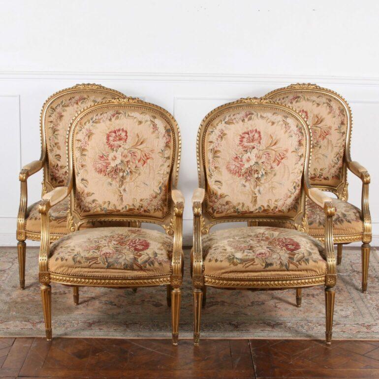 Louis XVI Style Fauteuils with original Aubusson upholstery. Original condition with horsehair stuffing. These pieces are exceptionally carved with gilt. The Aubusson tapestry is stunning and very good quality. C.1820.