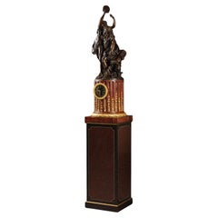Orologio a piedistallo figurato in stile Luigi XVI