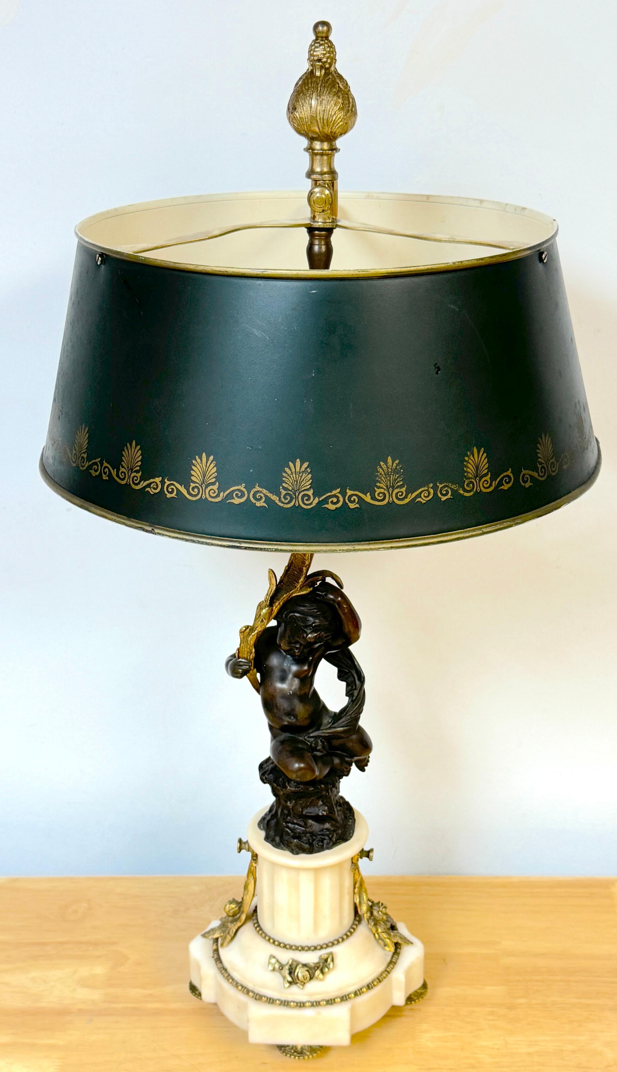 Louis XVI Style Figural Putti Ormolu & Bronze Tole Bouillotte Lamp
France, 19th century, electrified Circa 1925

This exquisite Louis XVI-style figural Bouillotte lamp from France, made in the 19th century and electrified circa 1925, is a fine