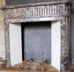 Cheminée de style Louis XVI en marbre Brocatelli