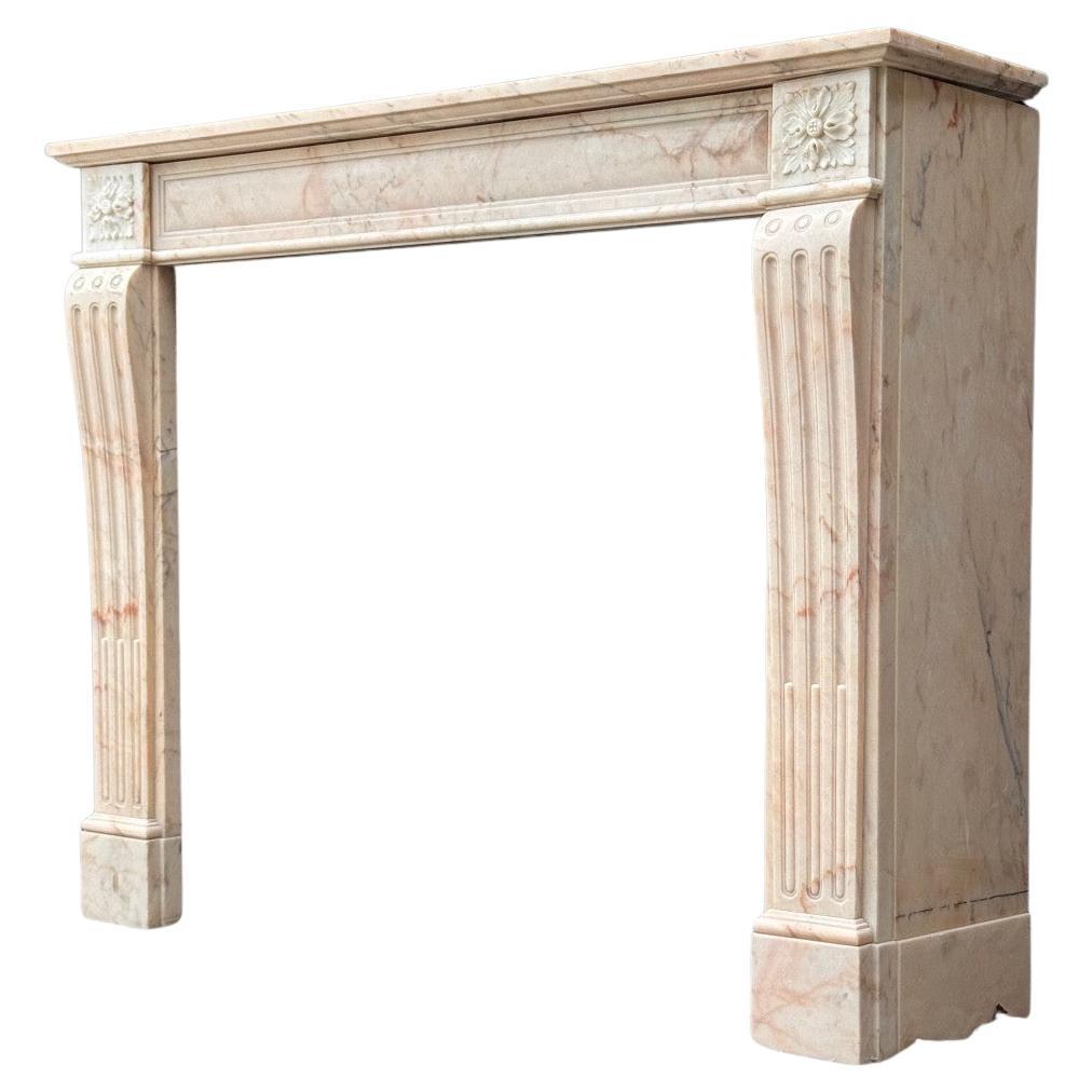 Louis XVI style fireplace in pink marble, circa 1920 For Sale