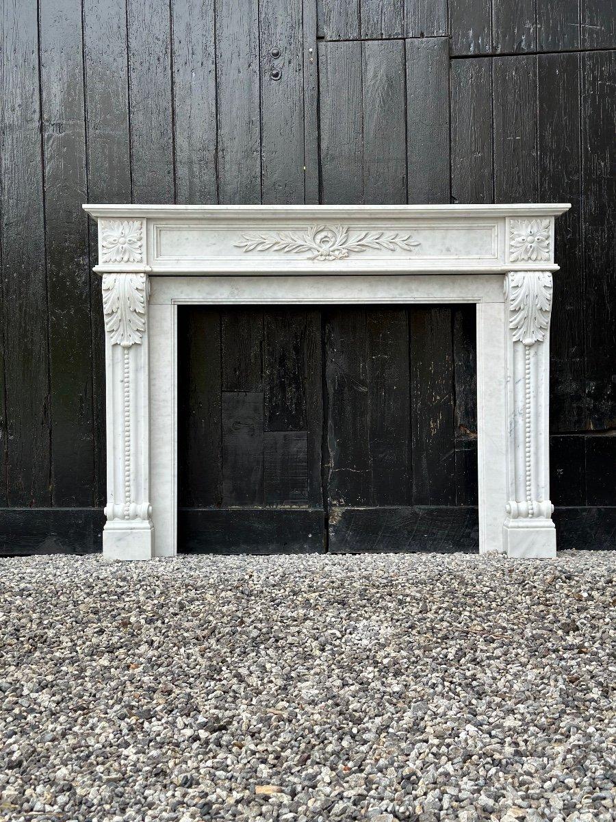 French Louis XVI Style Fireplace In White Carrara Marble, Circa 1980 For Sale
