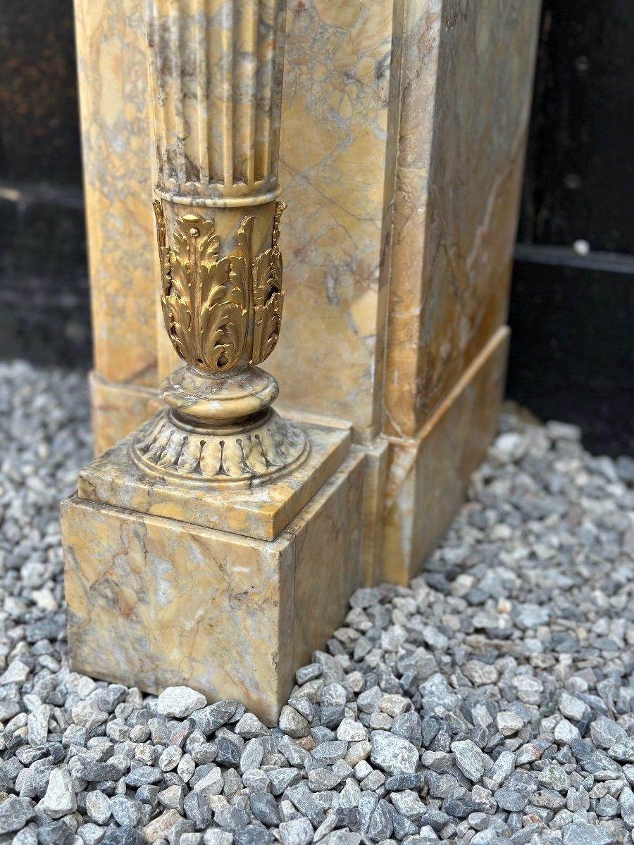 Louis XVI style fireplace in yellow Sienna marble garnished with gilt bronze dimensions of the hearth 87x122cm.