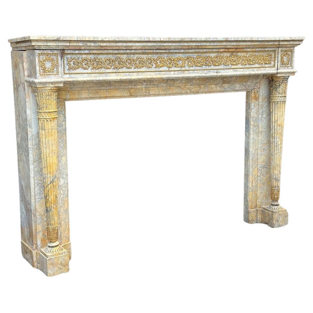 Louis XVI Style Fireplace in Yellow Siena Marble and Gilt Bronzes For Sale
