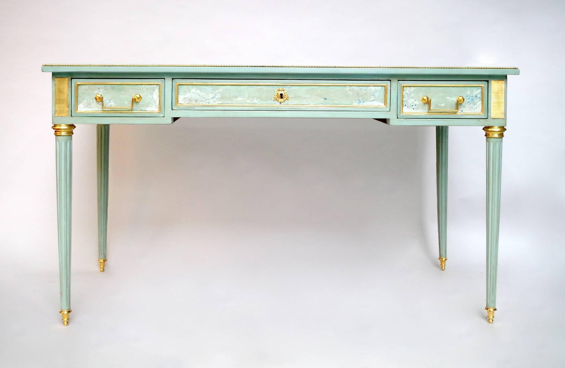 Small Louis XVI style flat desk in celadon lacquer with decoration of Asiatic landscapes on all sides.
Opening with three drawers in the facade and standing on four tapered legs with fluting.
Gilt bronzes decoration like scrappers on angles, lock