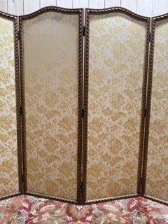 Louis XVI style folding screen in yellow silk and gilded stucco