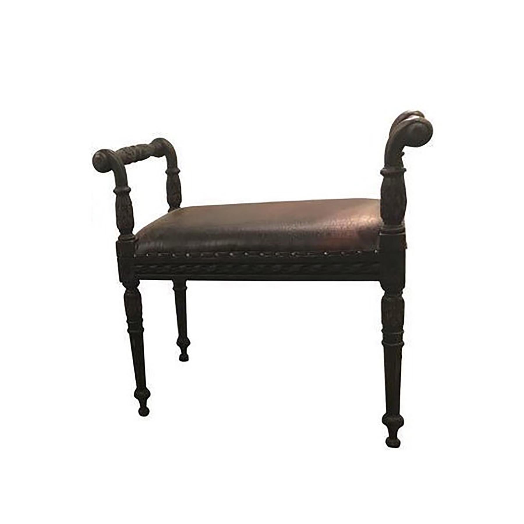 Louis XVI style French carved footstool or bench. Ebony finish. The carved frame supports a covered seat in faux alligator upholstery. Flanked by side arms. Measure: Seat height 18.5 inches.