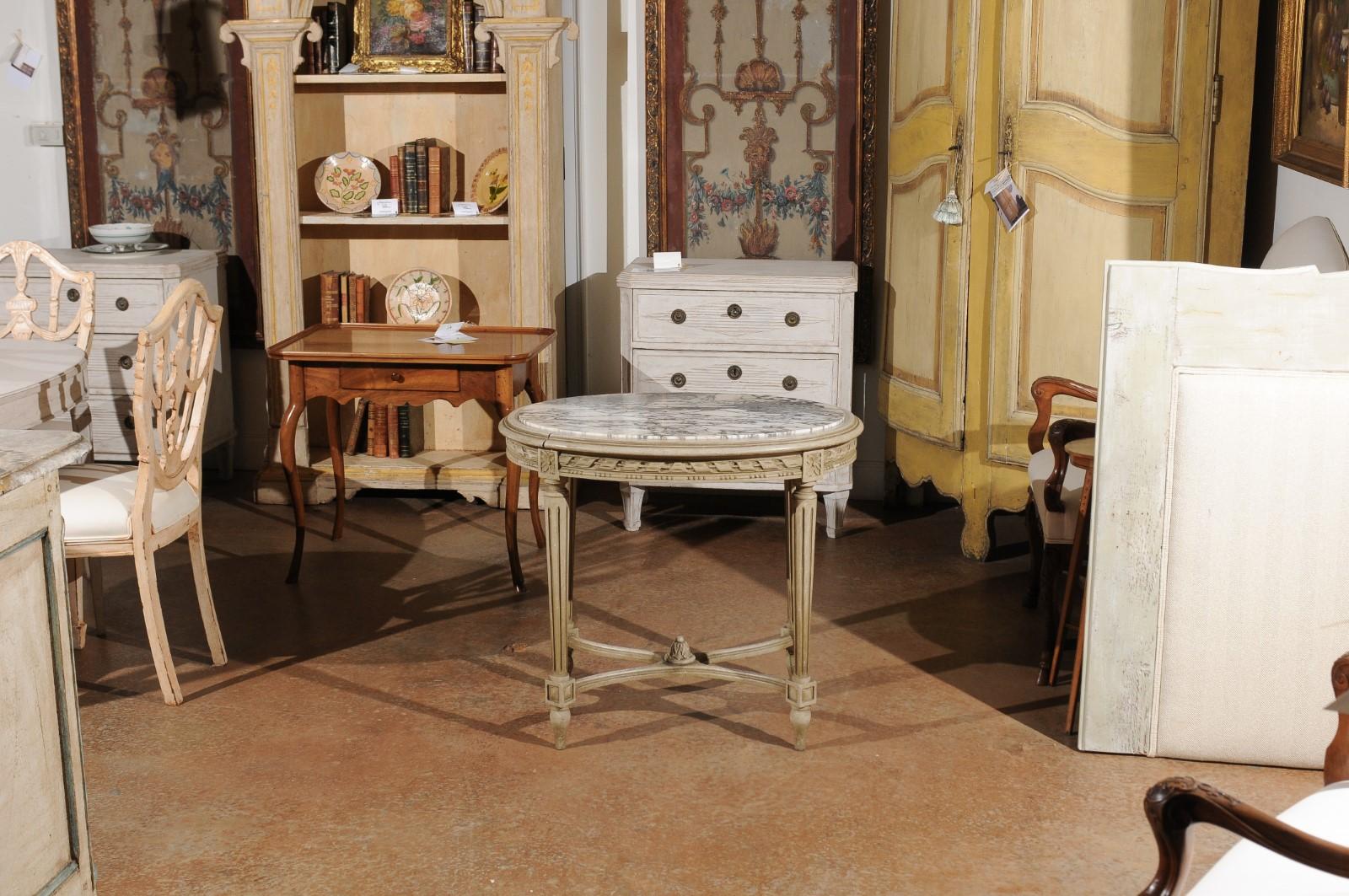 Carved Louis XVI Style French Accent Table with White Veined Oval Marble Top, 1890s