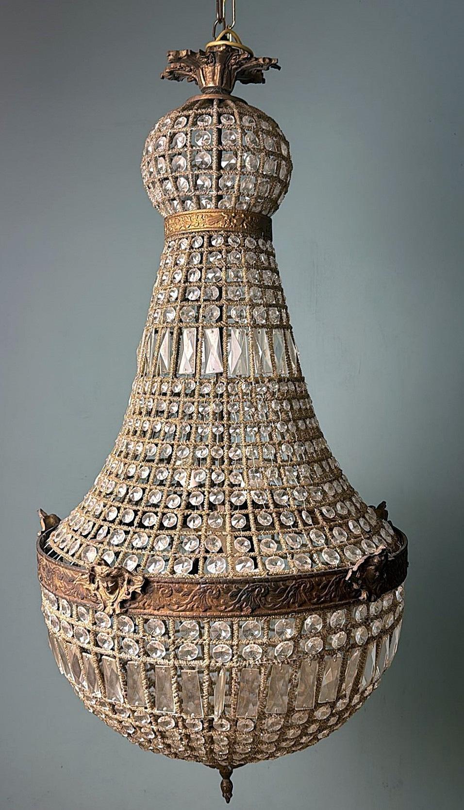 We kindly invite you to read the full description, as it provides detailed technical and historical information to guarantee the authenticity of our items.
This majestic and elegant French chandelier, crafted in the Louis XVI style, features the