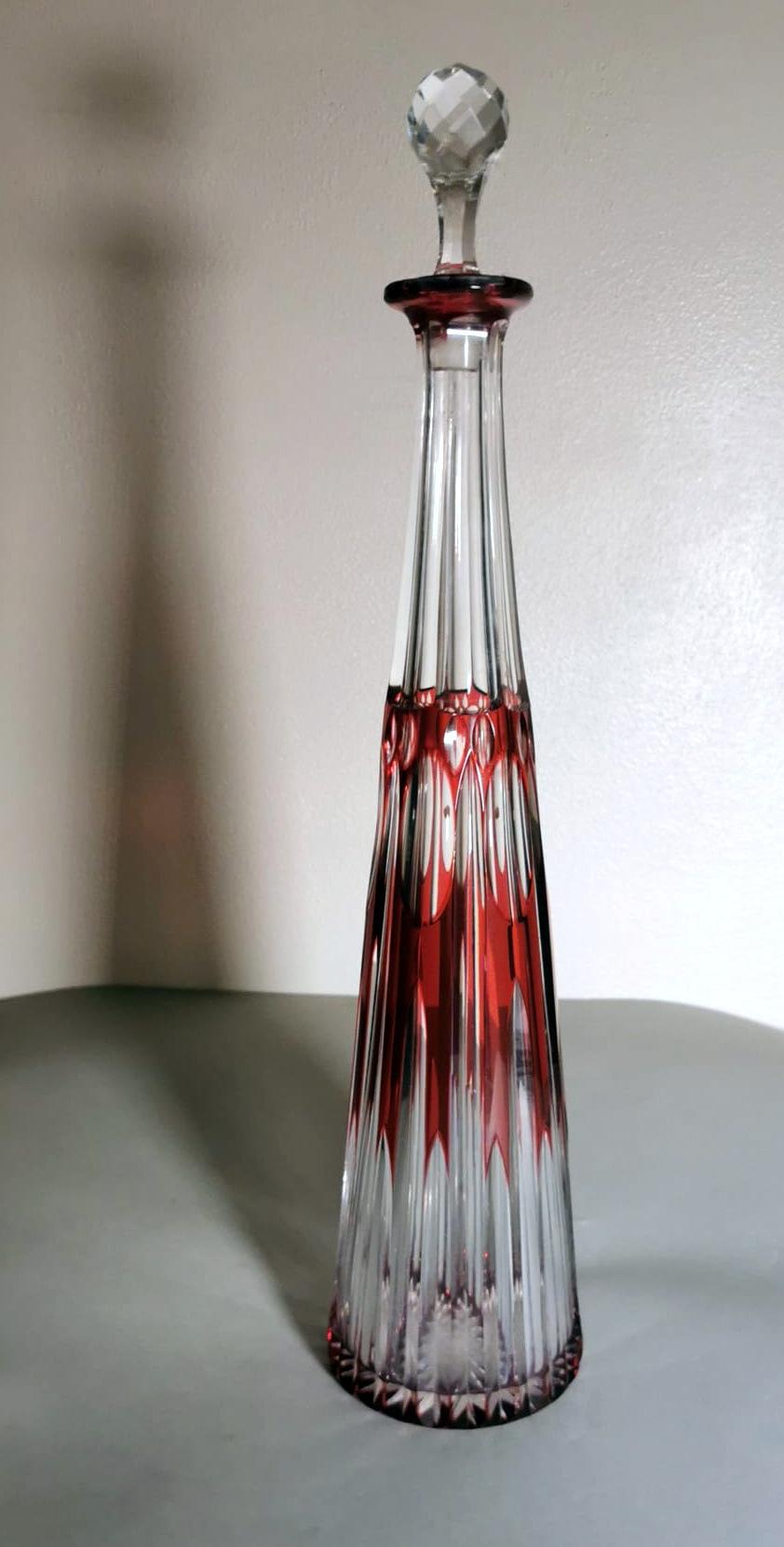 We kindly suggest you read the whole description, because with it we try to give you detailed technical and historical information to guarantee the authenticity of our objects.
Hand-cut and ground red crystal bottle; an excellent lead crystal was