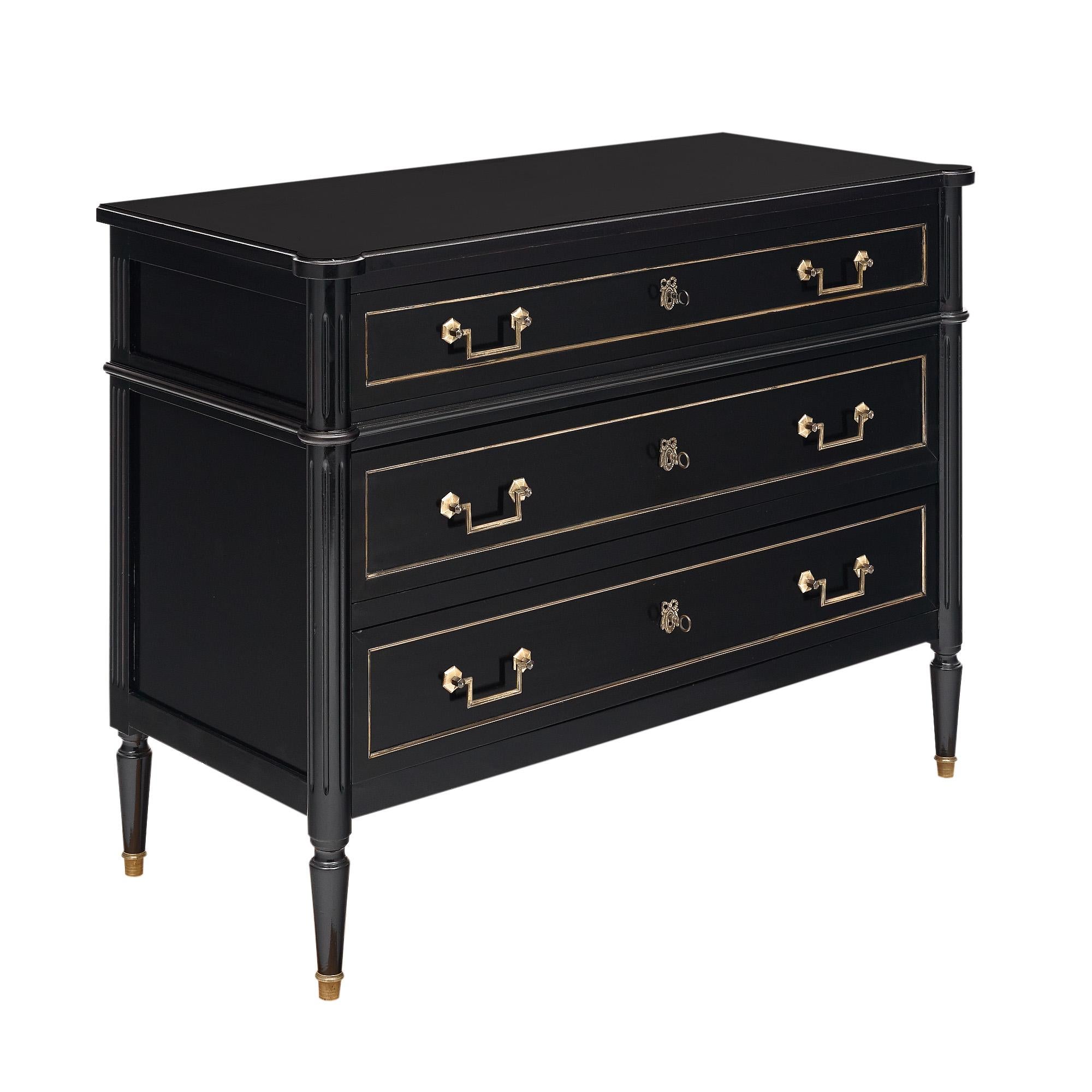 Chest of drawers from France in the Louis XVI style. This piece has been ebonized and finished with a French polish for a lustrous, museum-quality finish. The hardware and trim is all original and finely cast brass. There are three dovetailed