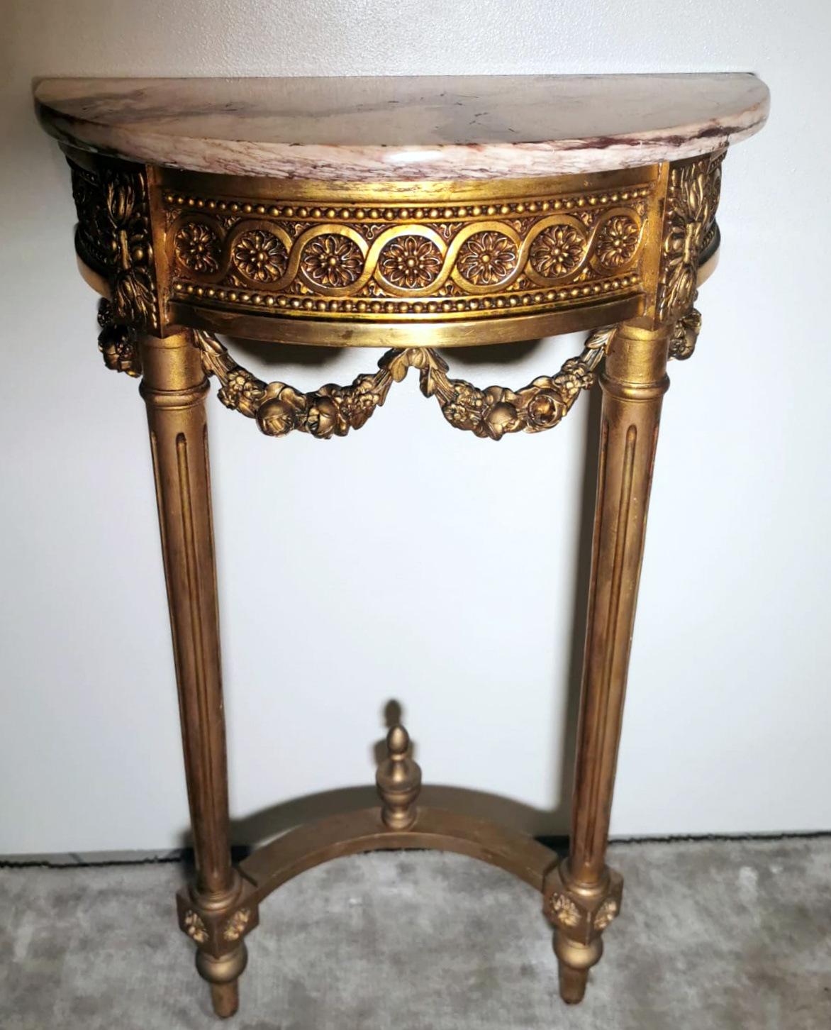 We kindly suggest you read the whole description, because with it we try to give you detailed technical and historical information to guarantee the authenticity of our objects.
Elegant and refined French console table in Louis XVI style in gilded