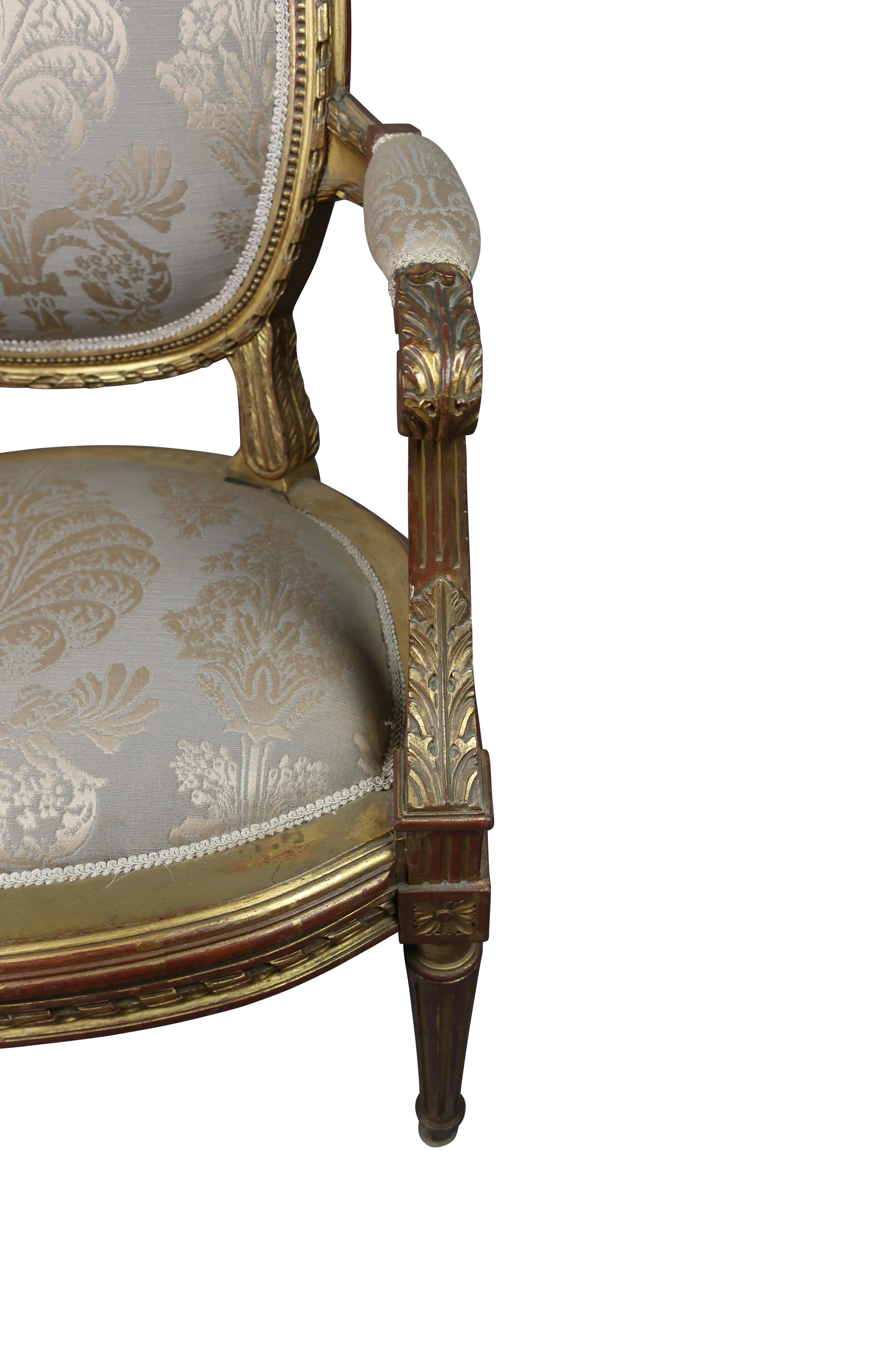 
The fauteuil à la Reine seen here is a perfect example of this Louis XVI style. This particular style of Louis XVI always featured a medallion-shaped back and fluted legs. This armchair seen here was hand-carved in France circa 1890. The