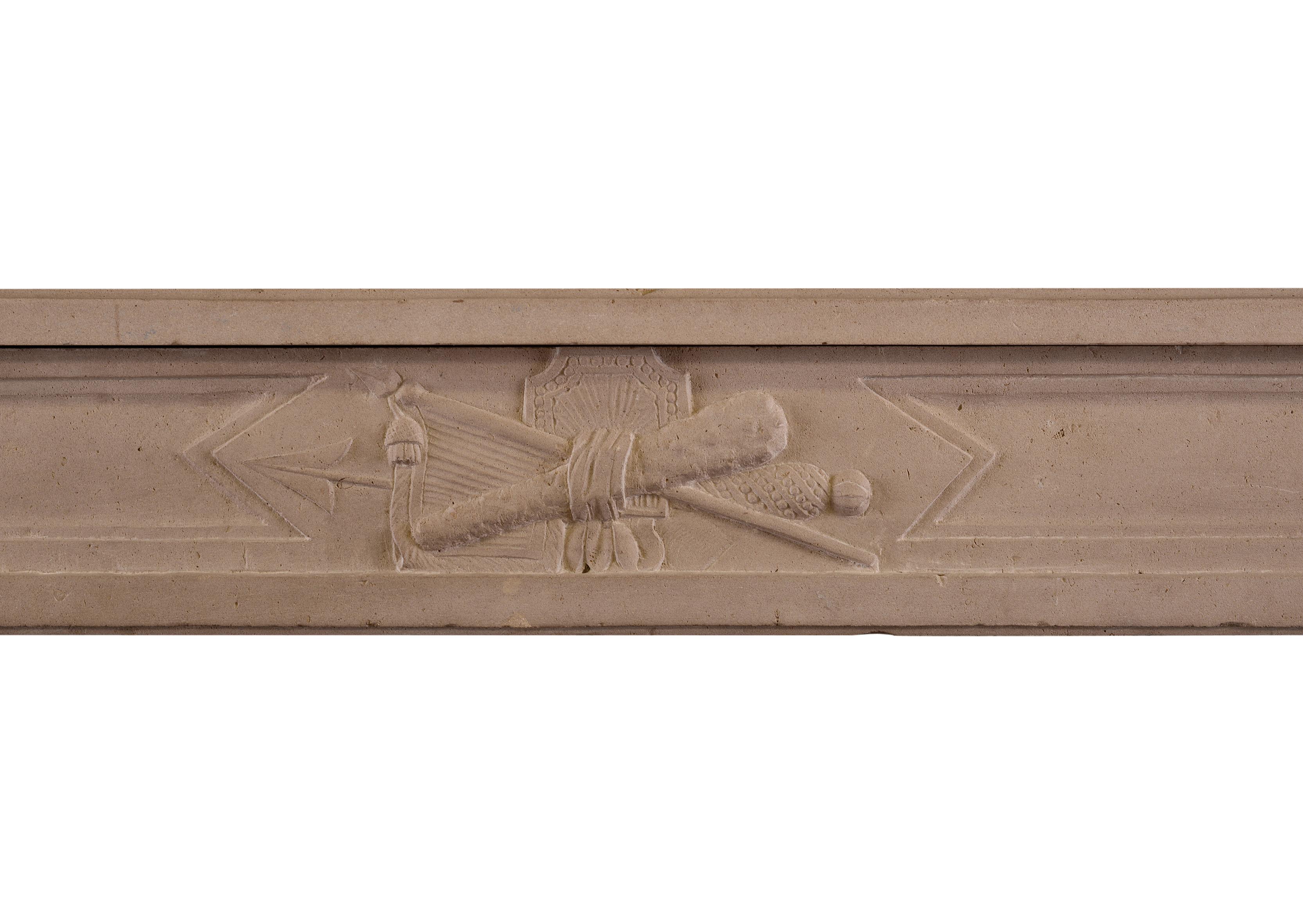 A 19th century French Louis XVI style stone fireplace. The stop-fluted jambs surmounted by frieze with carved arrow and musical instrument. Moulded shelf above.

Measurements:
Shelf width: 1335 mm 52 1/2 in
Overall height: 1065 mm 41 7/8 in
Opening