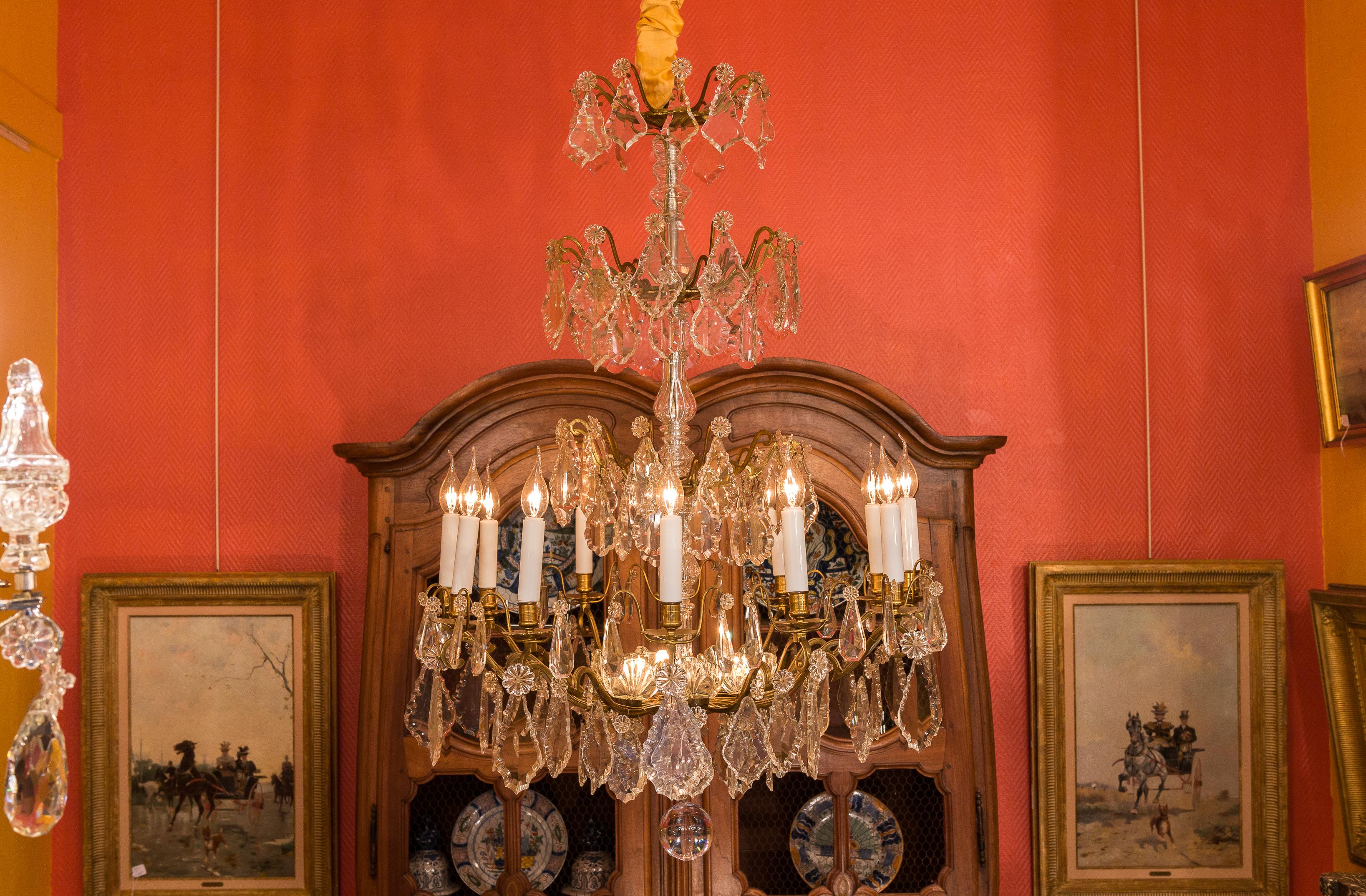 Louis XVI style, French mid-20th century, bronze and crystal chandelier, circa 1950.

A large, elegant and decorative gilt-bronze and cut-crystal chandelier in the classic French Louis XVI style. 
Our chandelier is composed of twelve perimeter