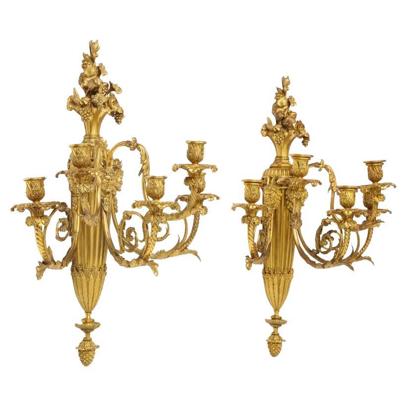 A very fine pair of Louis XVI style French ormolu bronze five-light wall appliques, sconces, Paris, circa 1870. 

Attributed to Henry Dasson, after the model by Thomire. 

Very high quality pair of wall-lights. Lots of detailing to every piece