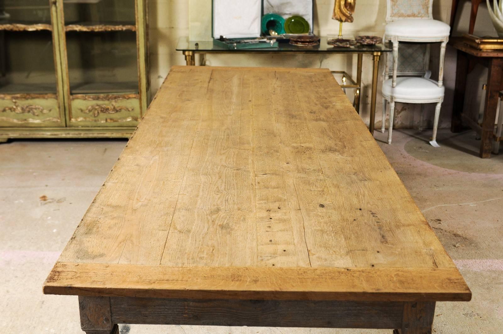 A French Louis XVI style stripped oak farm table with rectangular planked top raised on four tapered legs from the late 19th century. We’re often asked to be on the lookout for the perfect farm table - preferably oak, big enough for a kitchen but