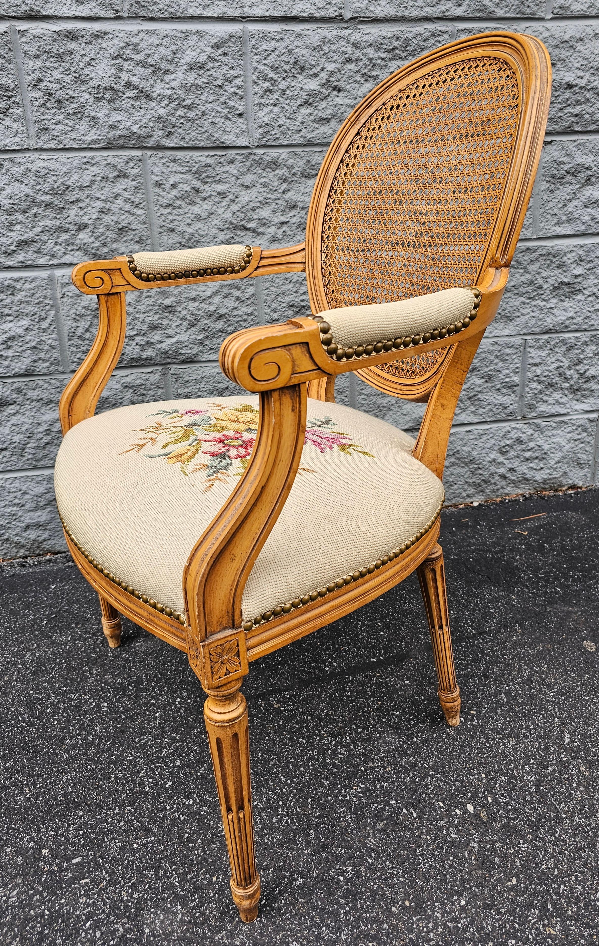 Louis XVI Style Fruitwood, Needlepoint Upholstered Seat And Caned Back Fauteuil In Good Condition For Sale In Germantown, MD