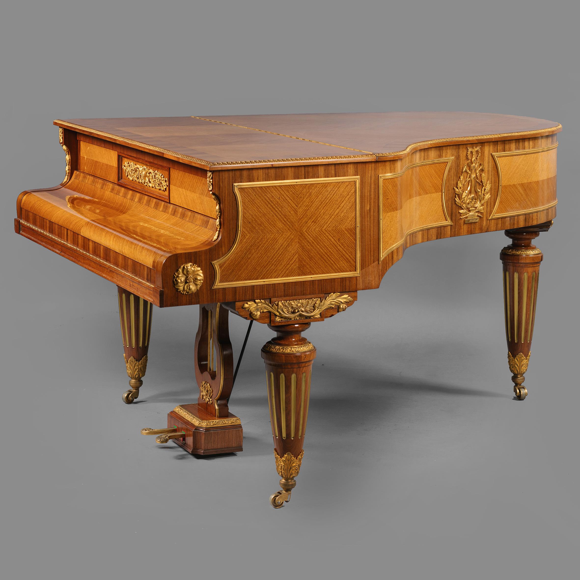 A fine Louis XVI style gilt-bronze mounted baby grand Piano by Gaveau à Paris. 

Serial number 67874.

This fine baby grand piano has a quarter-veneered top with a stiff leaf cast border above serpentine shaped frieze panels, centred to each