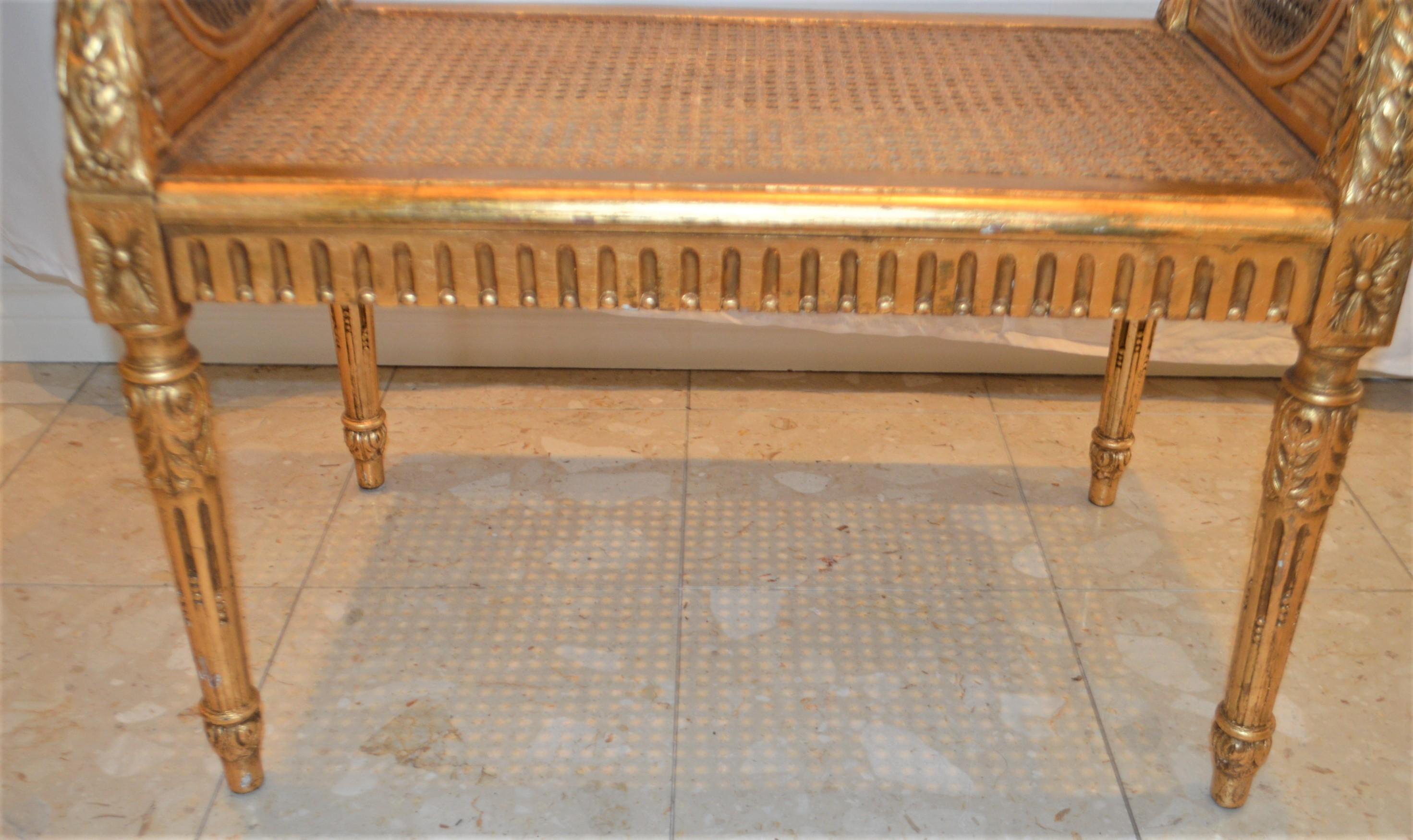 French Louis XVI style gilded cane bench, France circa 1900.