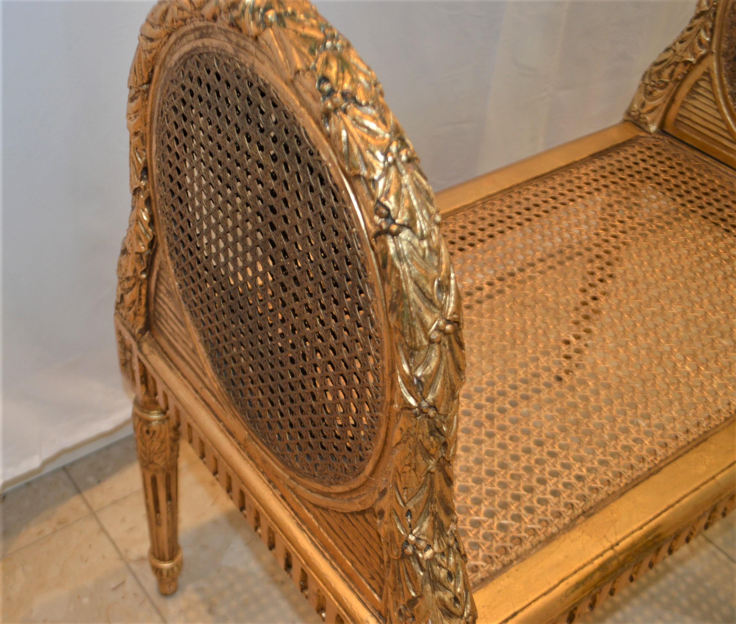 Wood Louis XVI style gilded cane bench, France circa 1900.