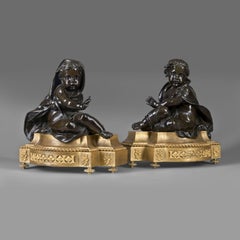 Chenets de style Louis XVI en bronze doré et patiné allégoriques de l'hiver