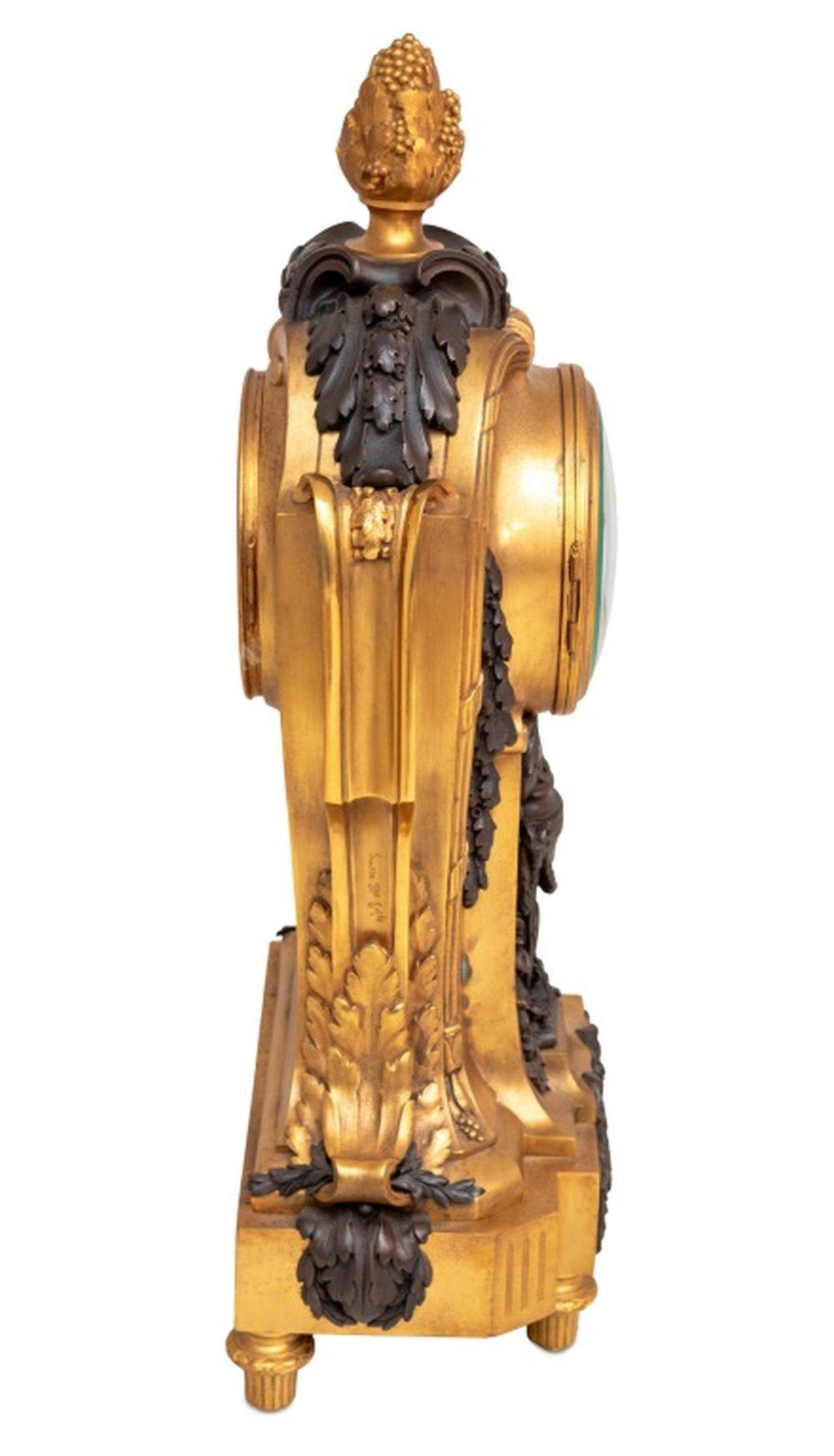French Louis XVI Style Gilt and Patinated Bronze Clock For Sale
