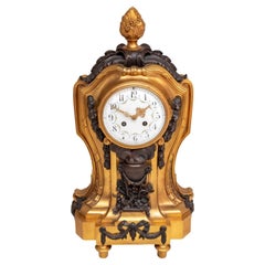 Louis XVI Style Gilt and Patinated Bronze Clock