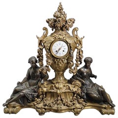 Louis XVI Style Gilt and Patinated Figural Bronze Clock