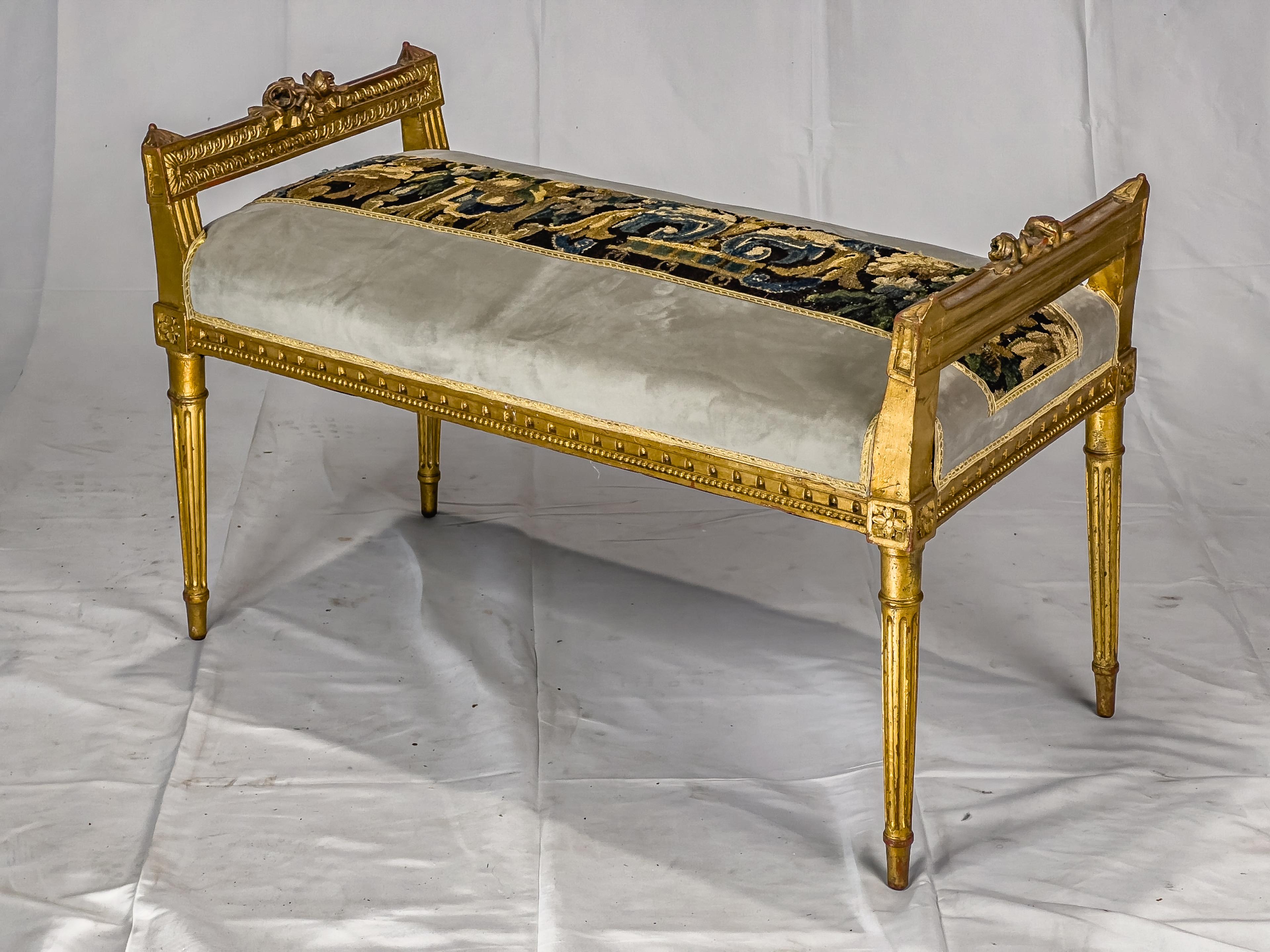 Louis XVI Style Gilt Bench Upholstered with an antique Aubusson Fragment centered on the tight seat covered in velvet.