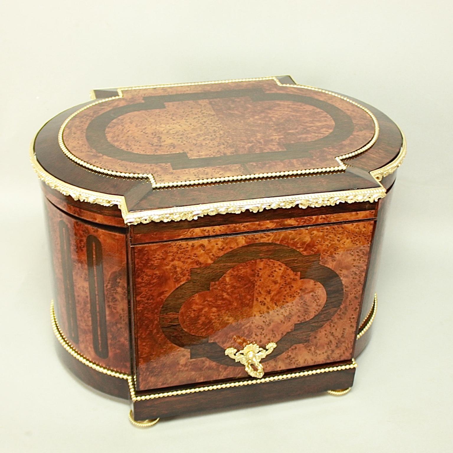 19th Century French Louis XVI Gilt Bronze and Bird's-Eye Maple Tantalus or Liquor Caddy

Excellent Louis XVI style marquetry tantalus, manufactured circa 1860, bearing the original label of Maison Hennon Bernassau à Nîmes: oblong in shape with a