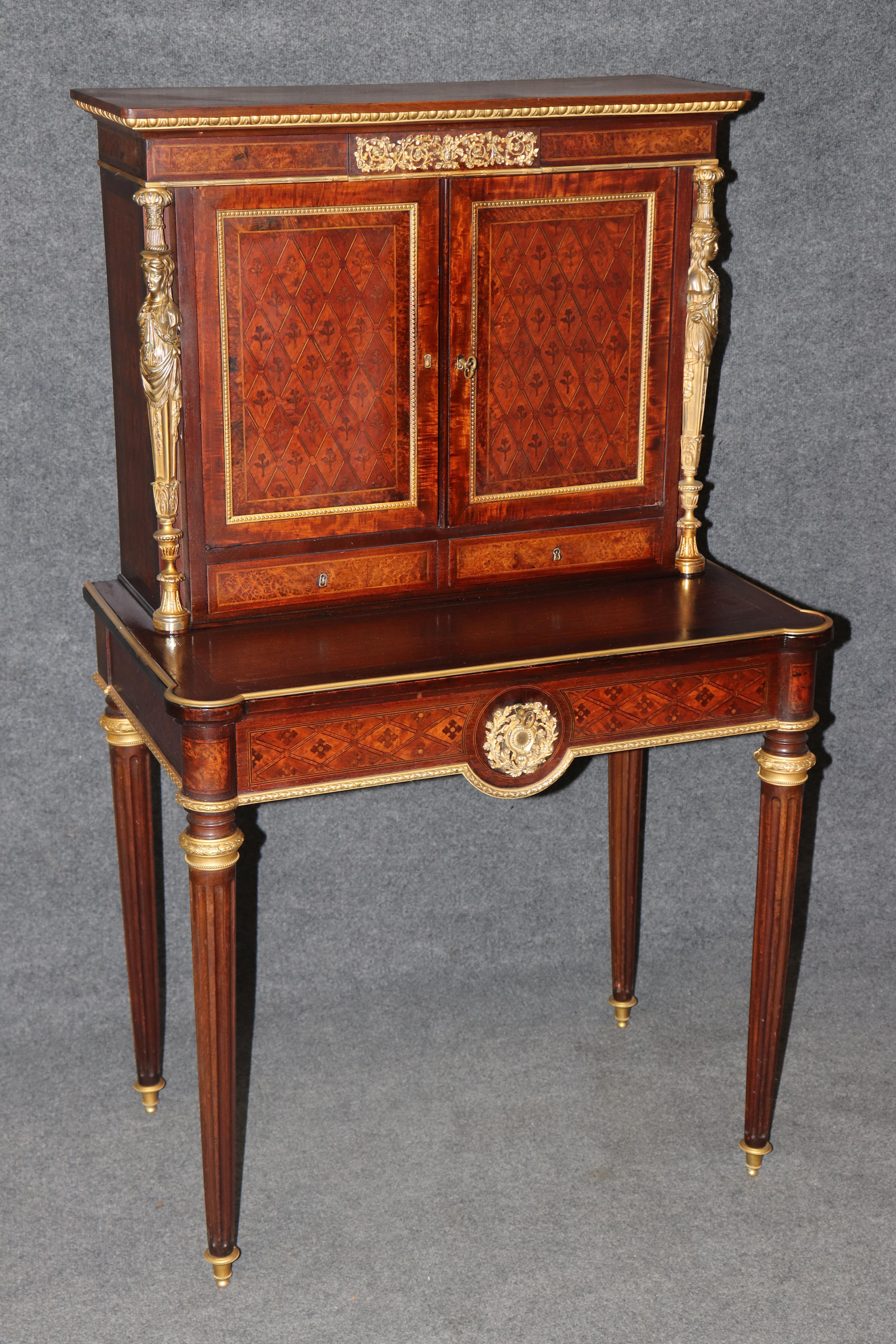 

This exquisite French Louis XVI secretary desk exemplifies the refined elegance and craftsmanship of late 18th to early 19th century French furniture. Constructed from rich mahogany and finely detailed with intricate marquetry, the piece is