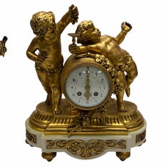 Louis XVI Style Gilt Bronze and Marble Cherub Clock Garniture